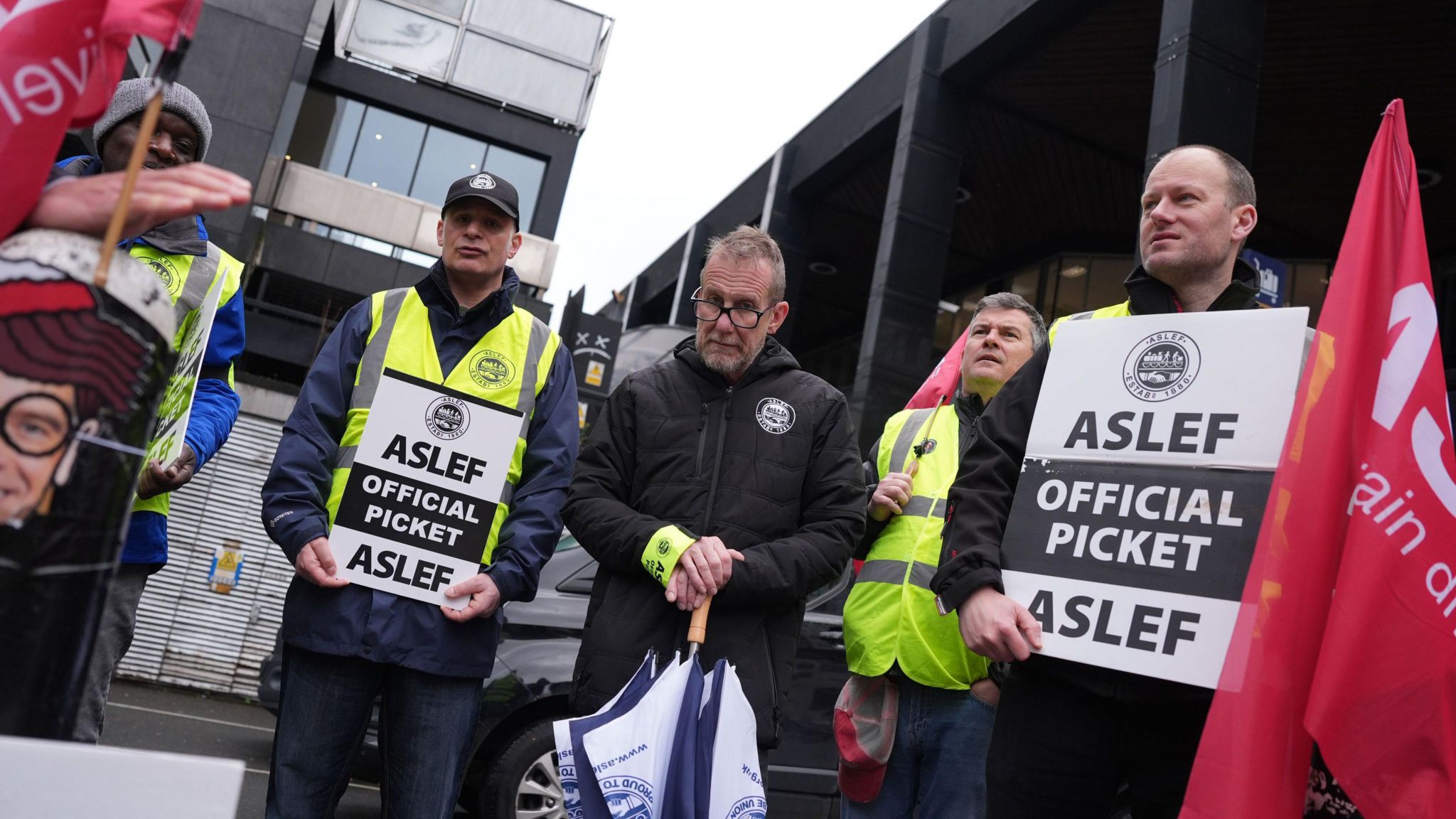 Aslef members stand on a picket line outside London Euston station