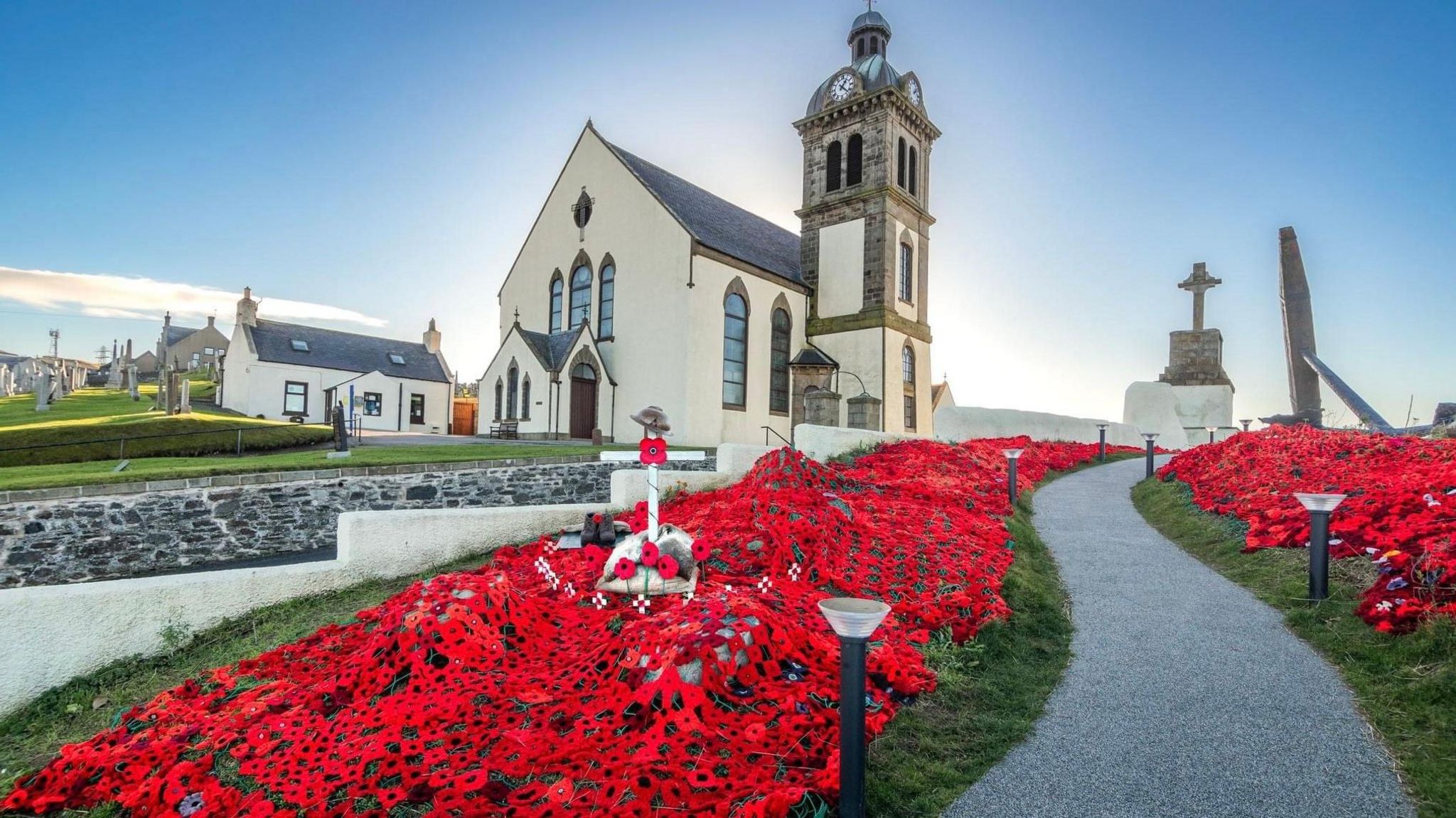 Macduff Parish Church poppy display wider shot with path