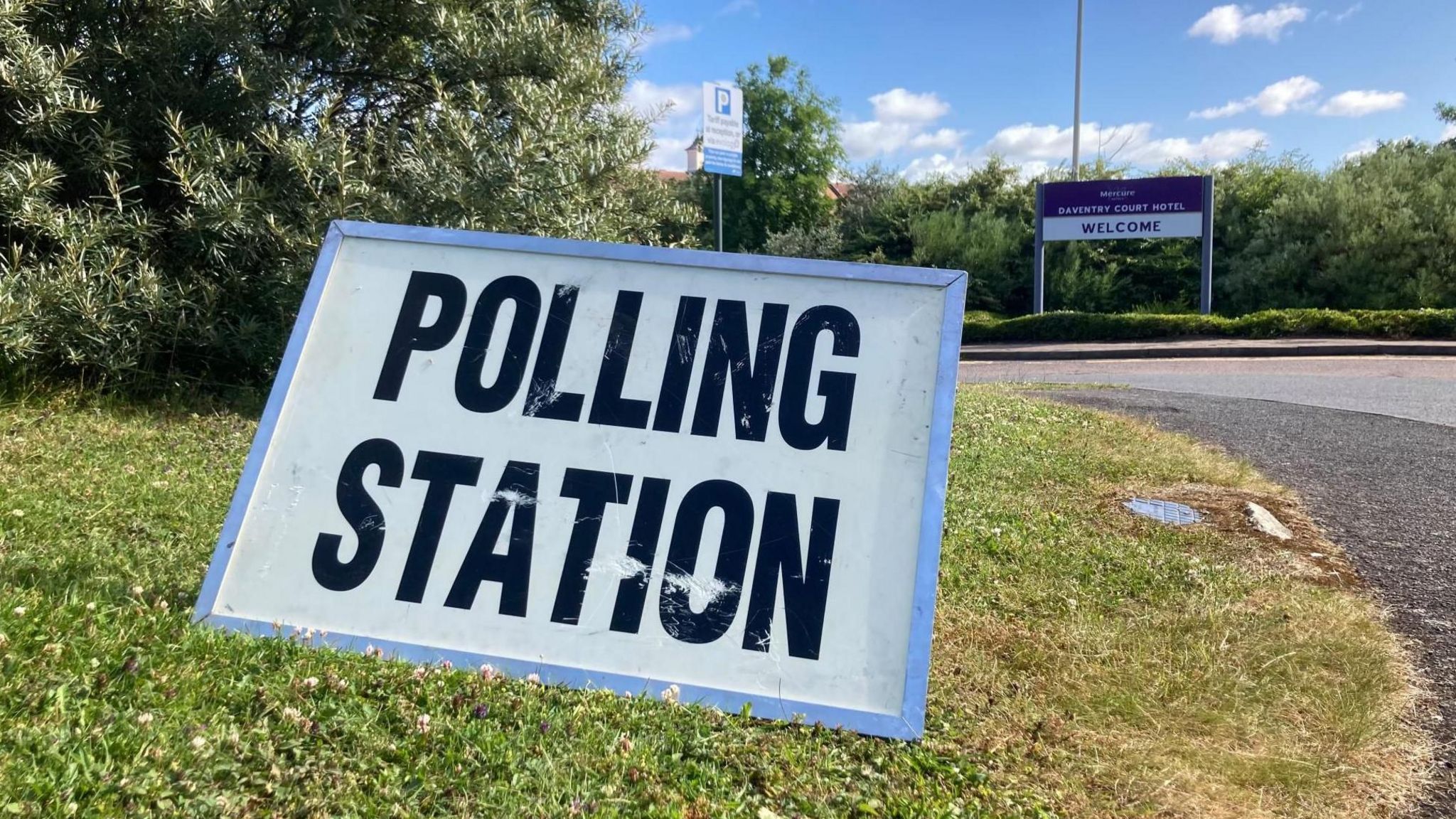 Polling station sign on grass in Daventry