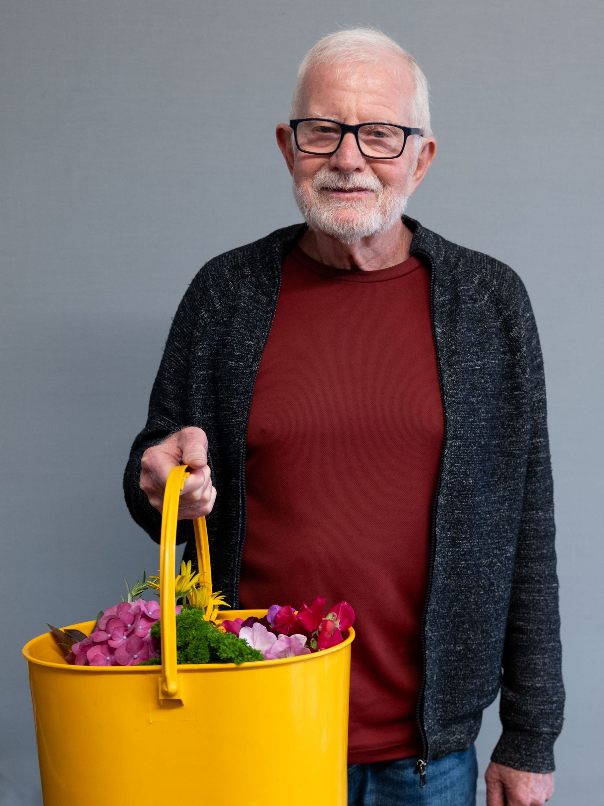 Bob Stevenson with a basket of flowers