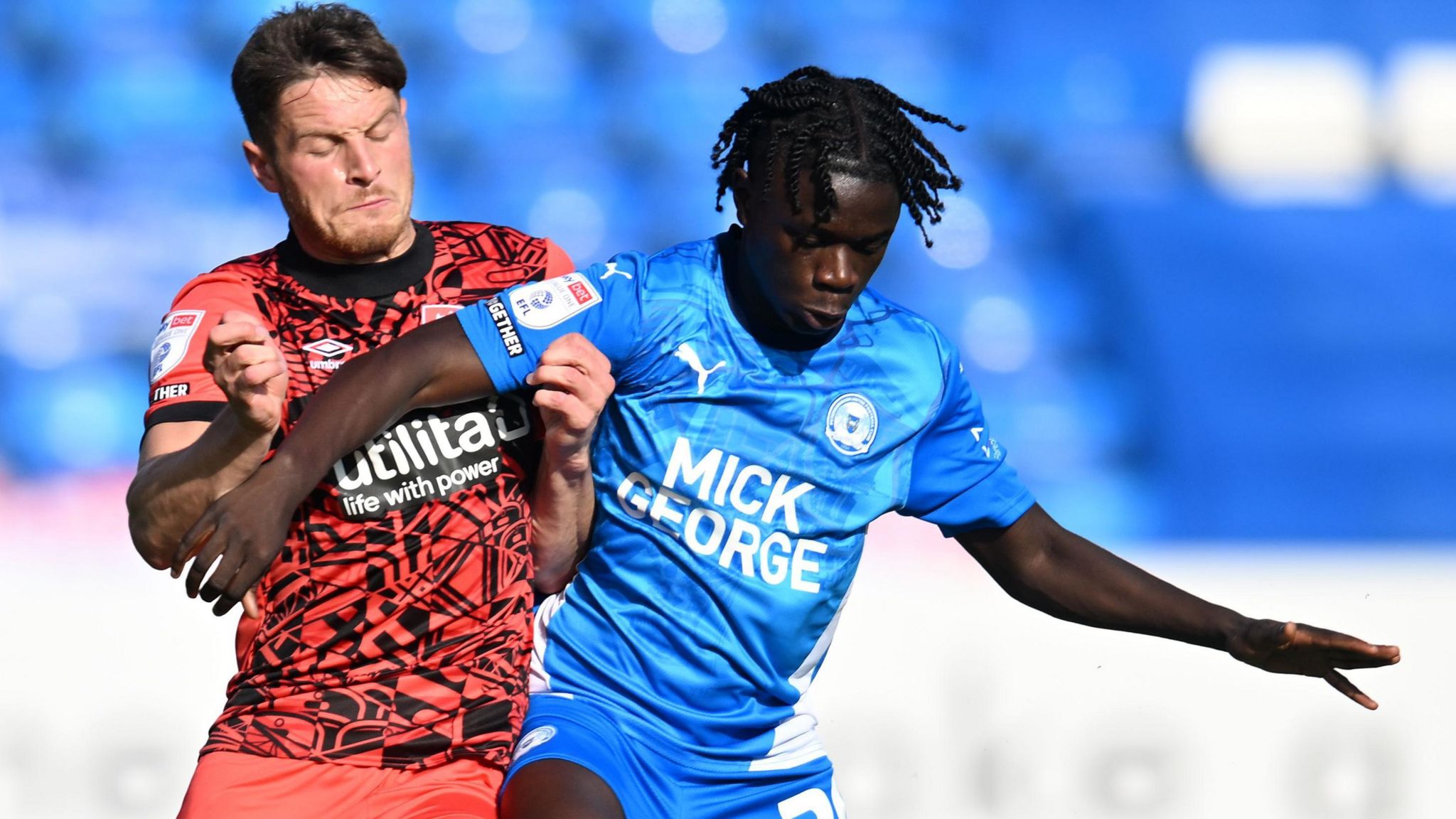 Mahamadou Susoho challenges Huddersfield's Ben Wiles