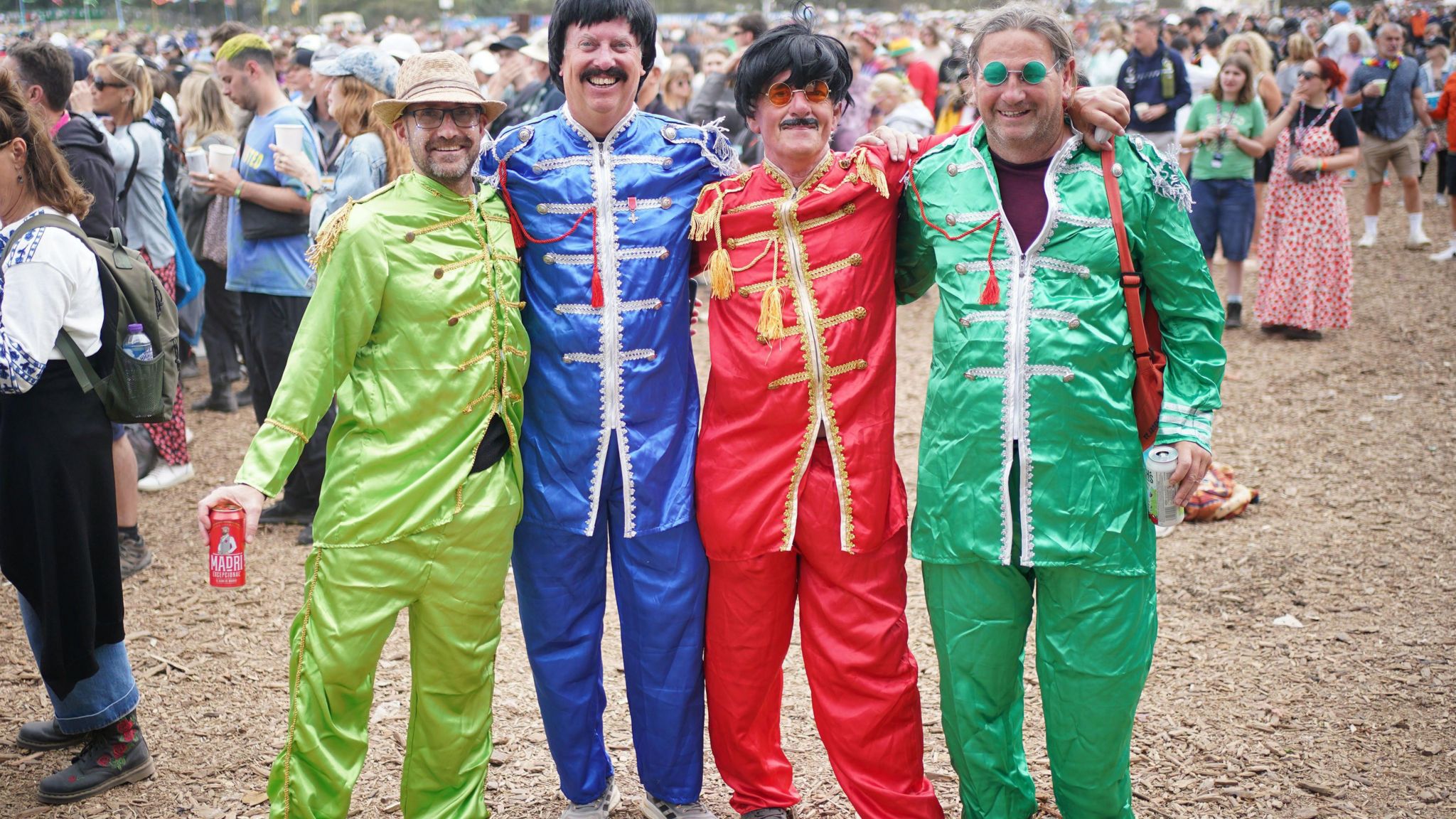 Festival goers dressed as the Beatles