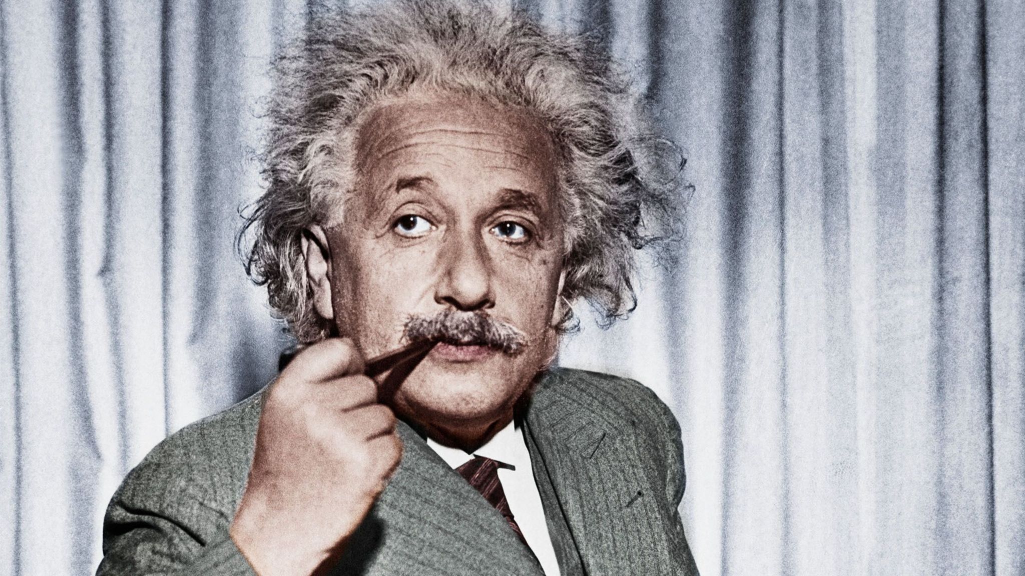 Albert Einstein smoking a pipe