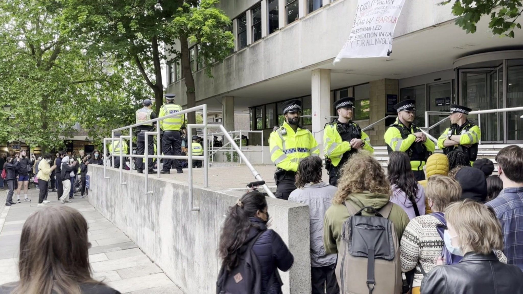 Police outside an Oxford university building, stopping people from entering