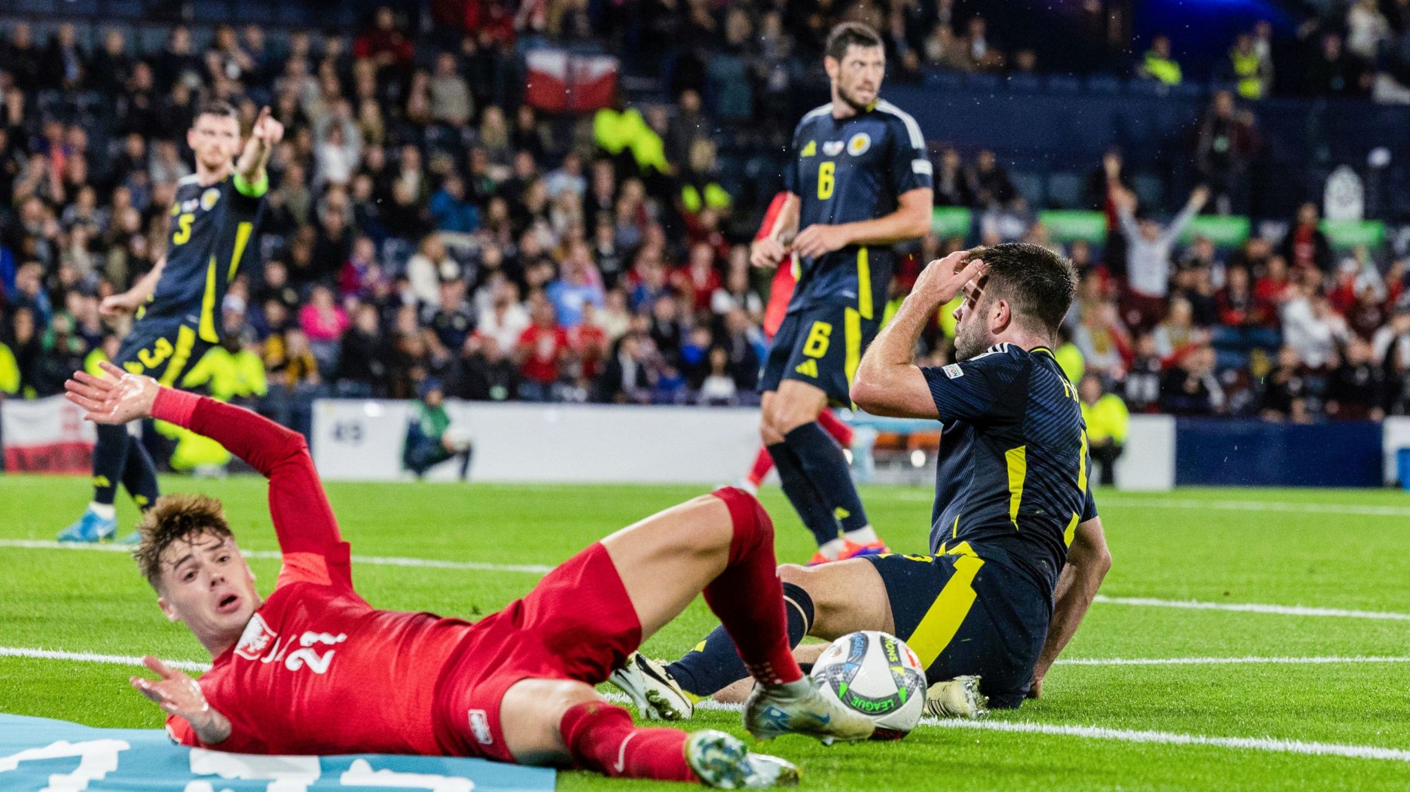 Scotland's Grant Hanley concedes a penalty against Poland