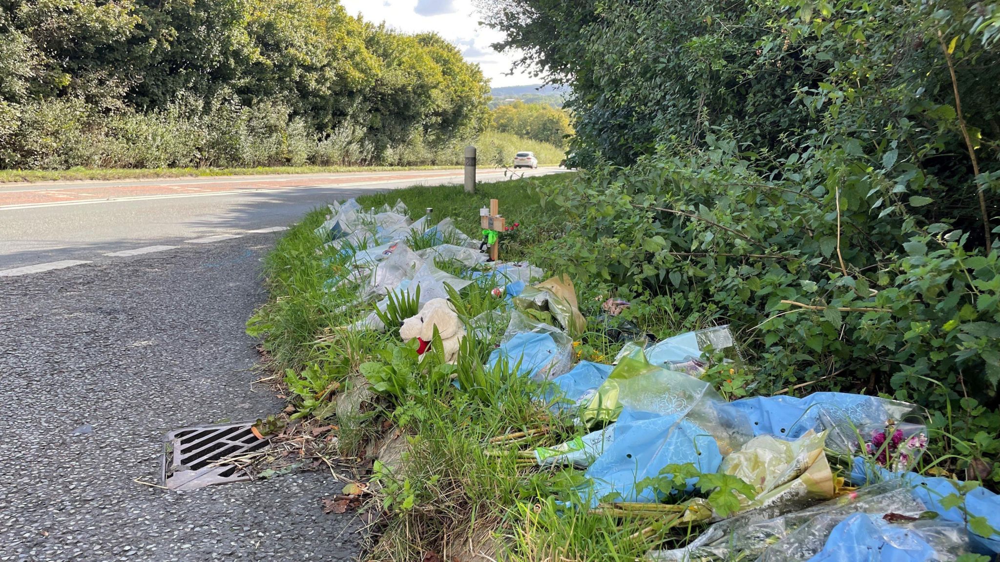 Flowers and small gifts left at the roadside on the A361 near Frome