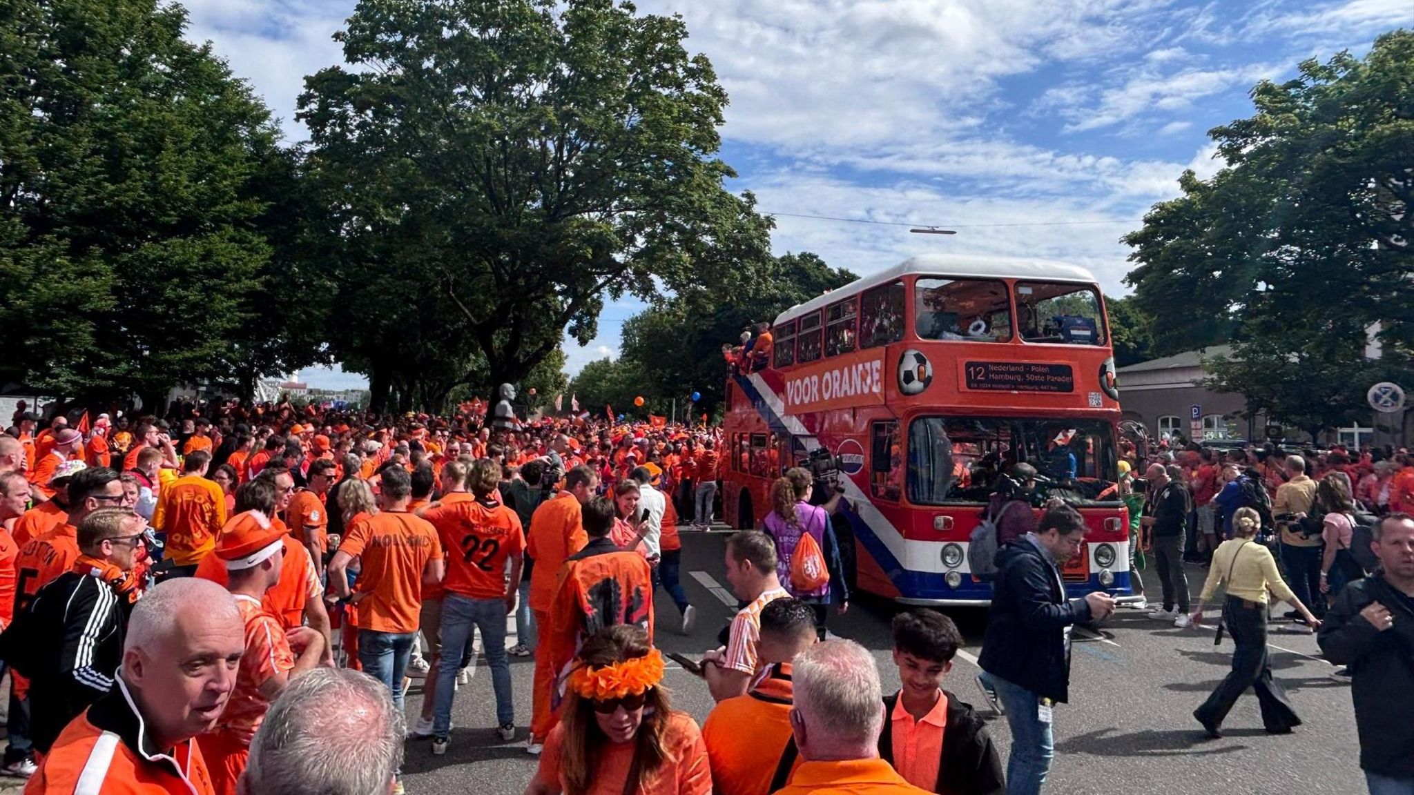 The double-decker bus that leads the Dutch fan parade