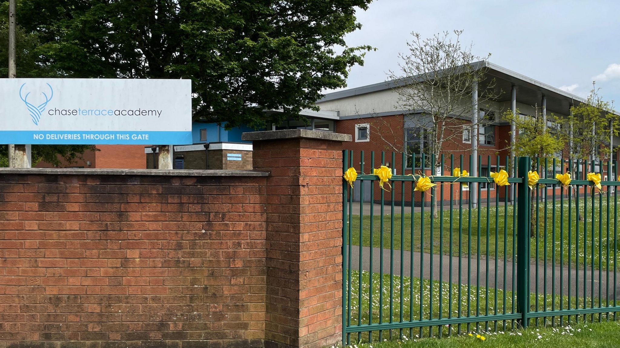 Yellow bows on the gates of Stephen's school