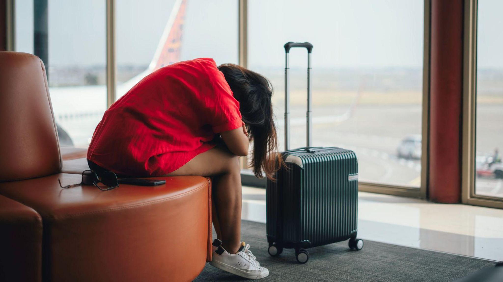 Woman in despair at airport