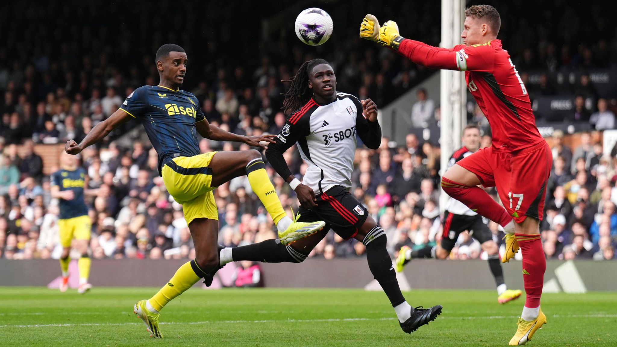 Fulham goalkeeper Bernd Leno punches clear from Newcastle United's Alexander Isak 