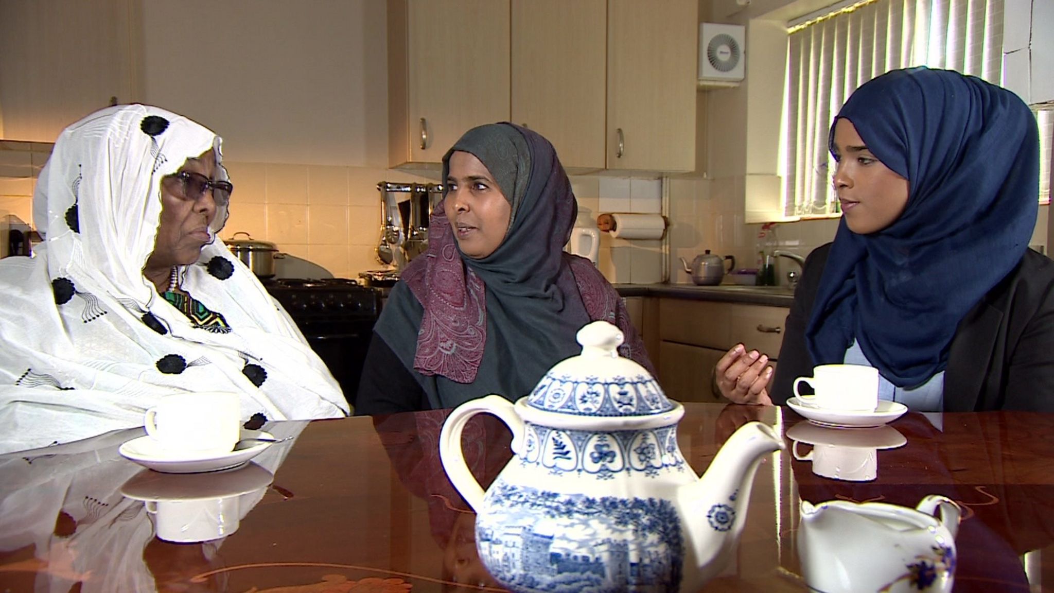 From left to right: Habiba Osman, Aisha Mohammed and Yasmin Ahmed discuss female genital mutilation at the kitchen table