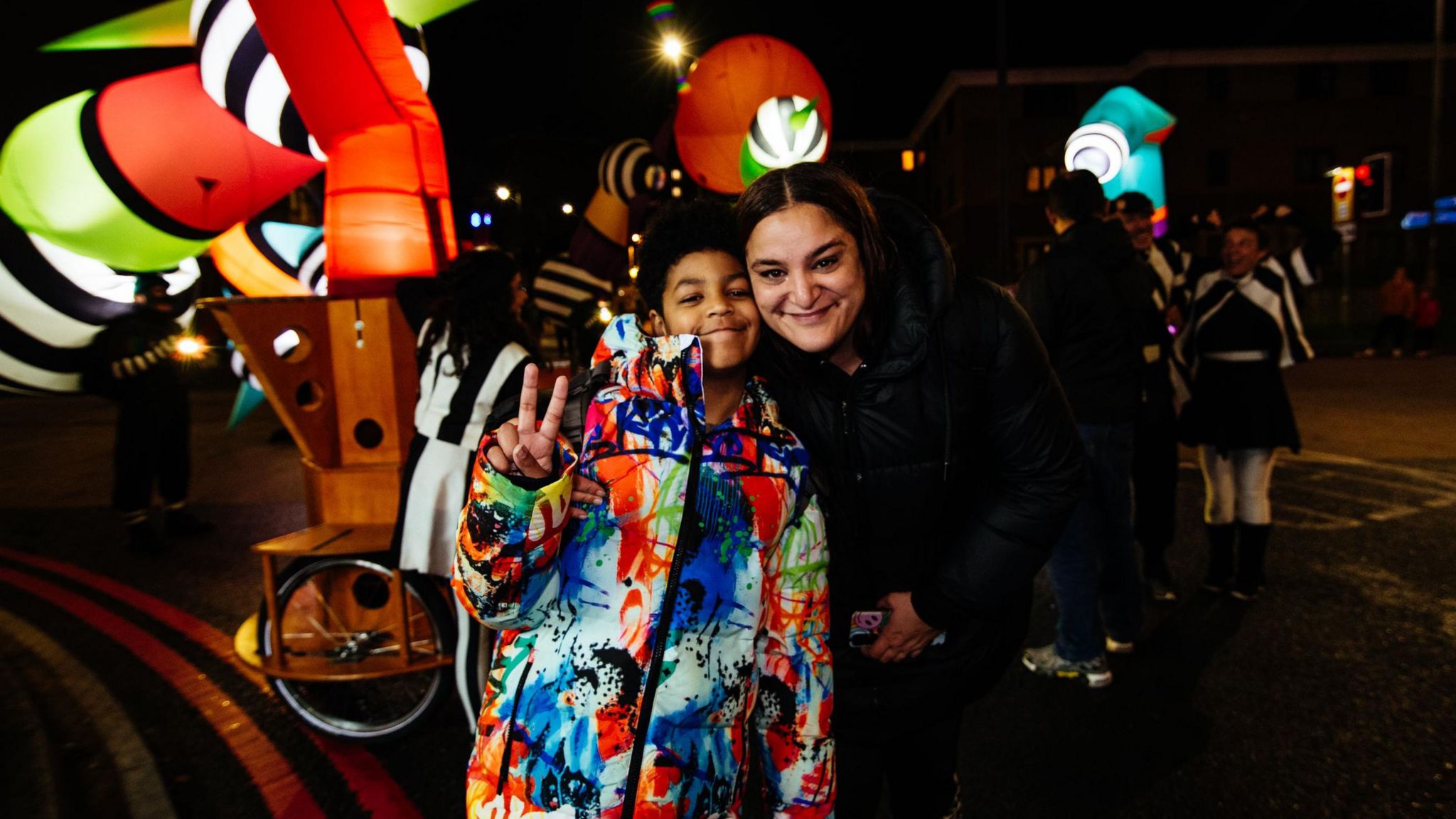 Woman and child at Lampadophores light show in Luton