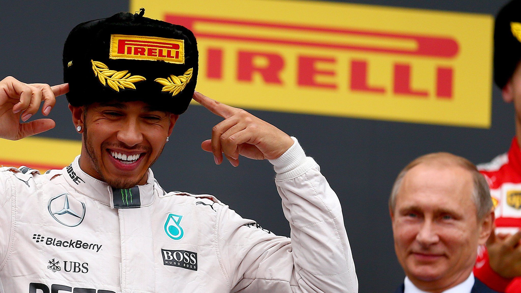 lewis hamilton at the russian gp with vladimir putin in the background