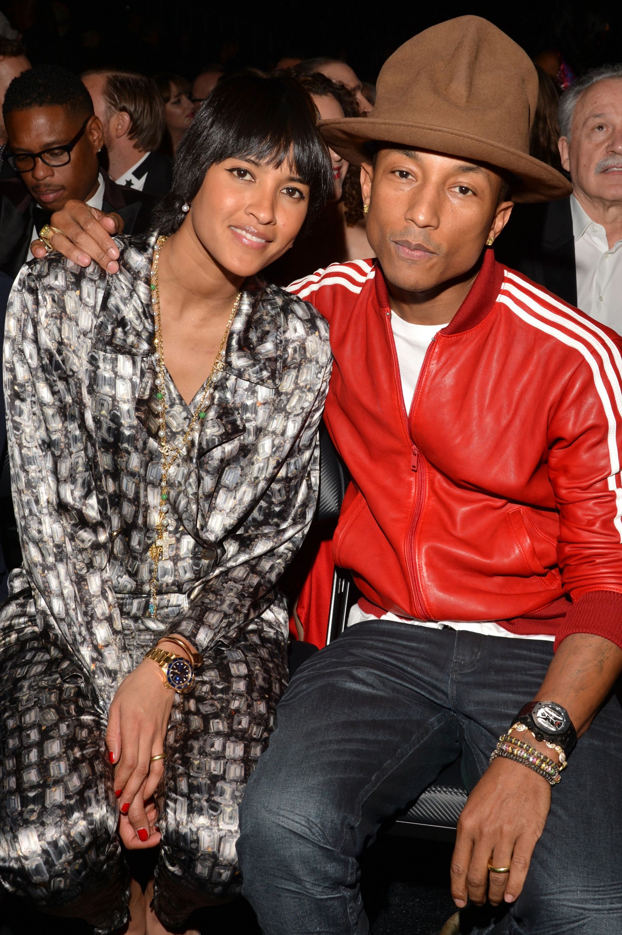 Helen Lasichanh (left) and Pharrell Williams attend the 56th GRAMMY Awards at Staples Center, 26 January 2014 in Los Angeles, California