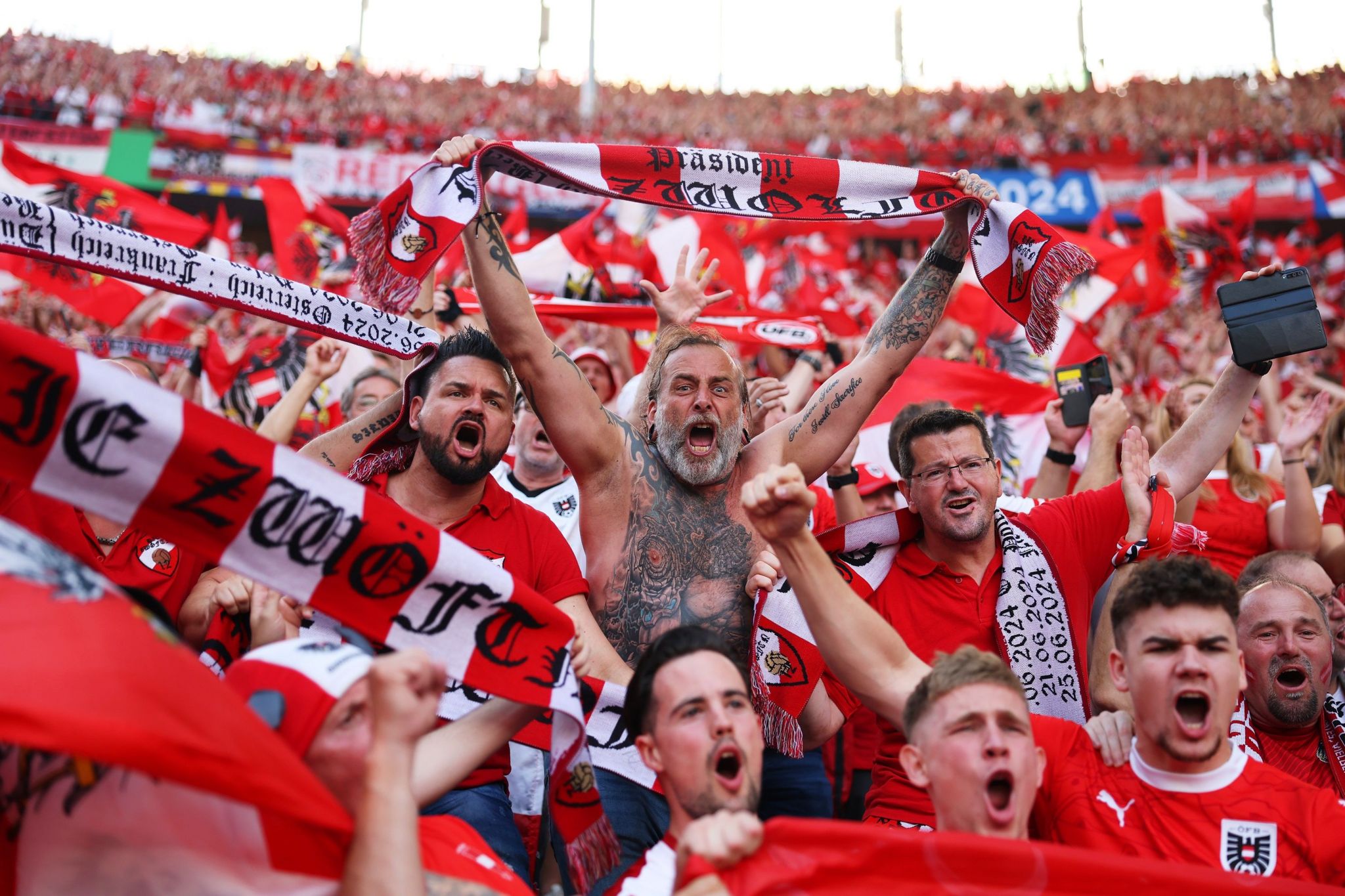 Austria fans celebrate victory over Poland in the group stage