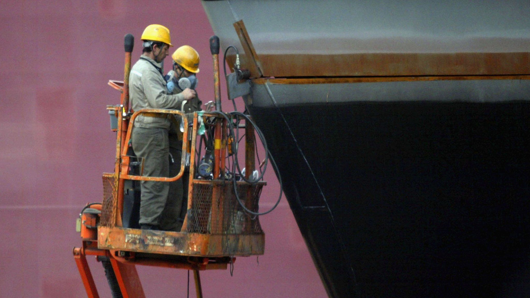 Workers of Daewoo Shipbuilding & Marine Engineering (DSME) work on a ship in Geoje Island, South Korea