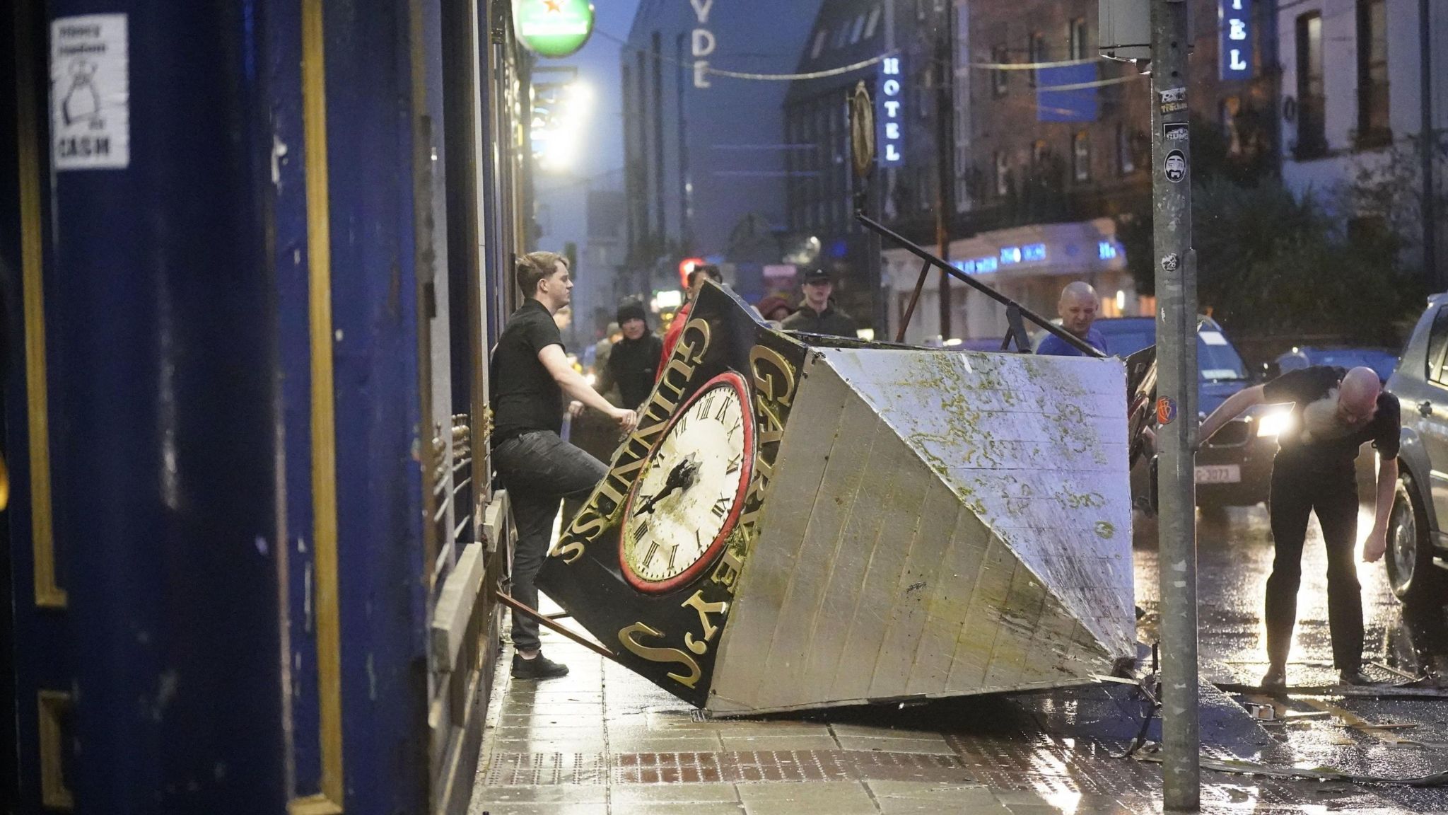  A clock tower falls to the ground in Eyre Square, Galway, during Storm Isha. A Status Red wind warning has been issued for counties Donegal, Galway and Mayo as authorities warn people to take care ahead of Storm Isha's a