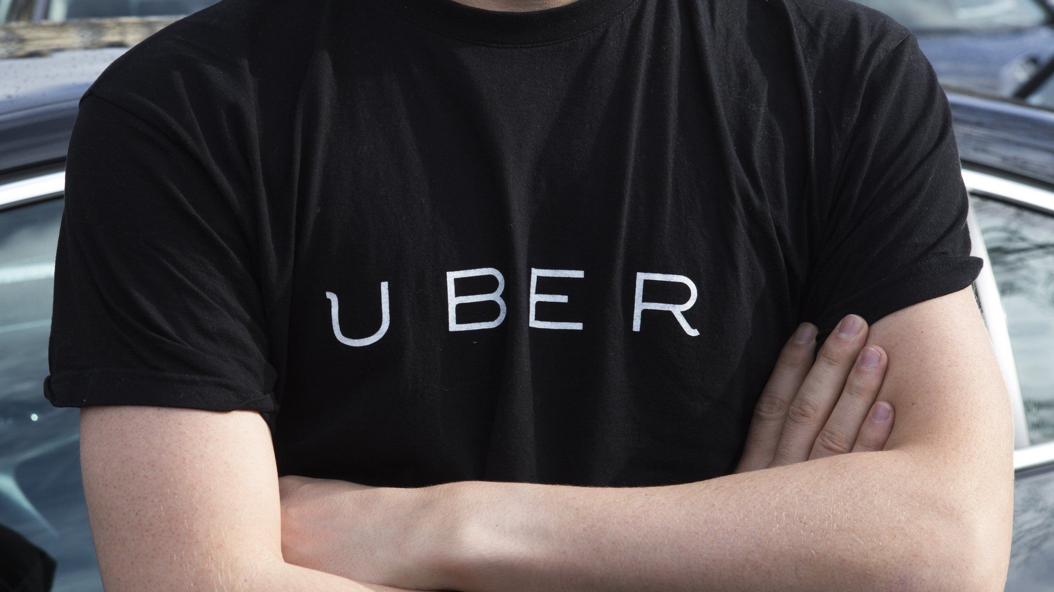 Uber logo written on t-shirt