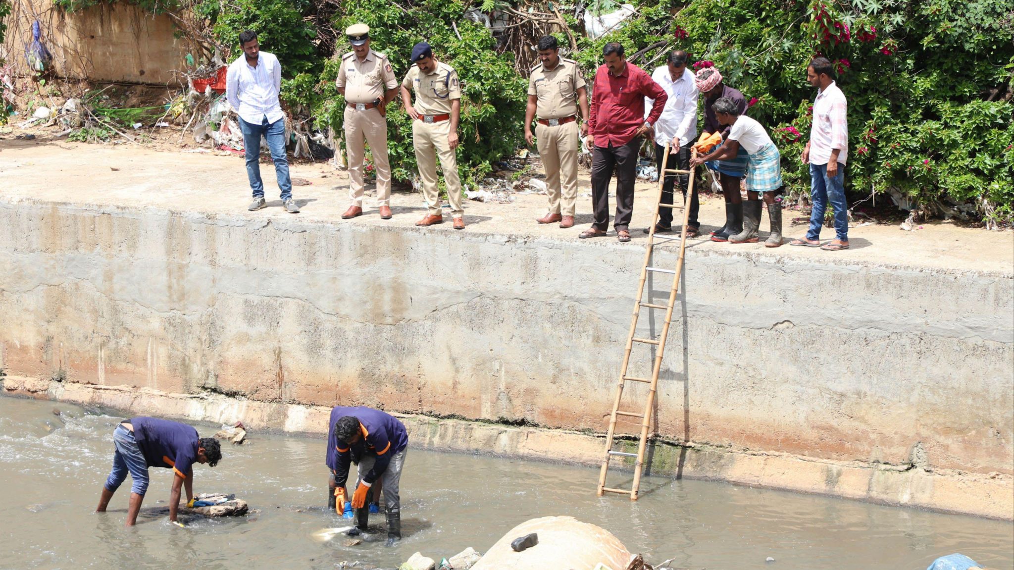 Investigators hunt for clues in the drain where Renukaswamy's body was found