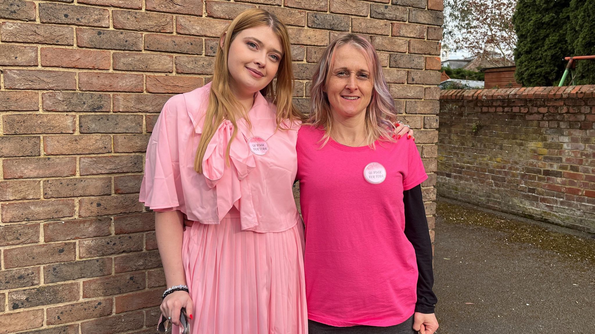 Rowan and her mum dressed in pink and smiling