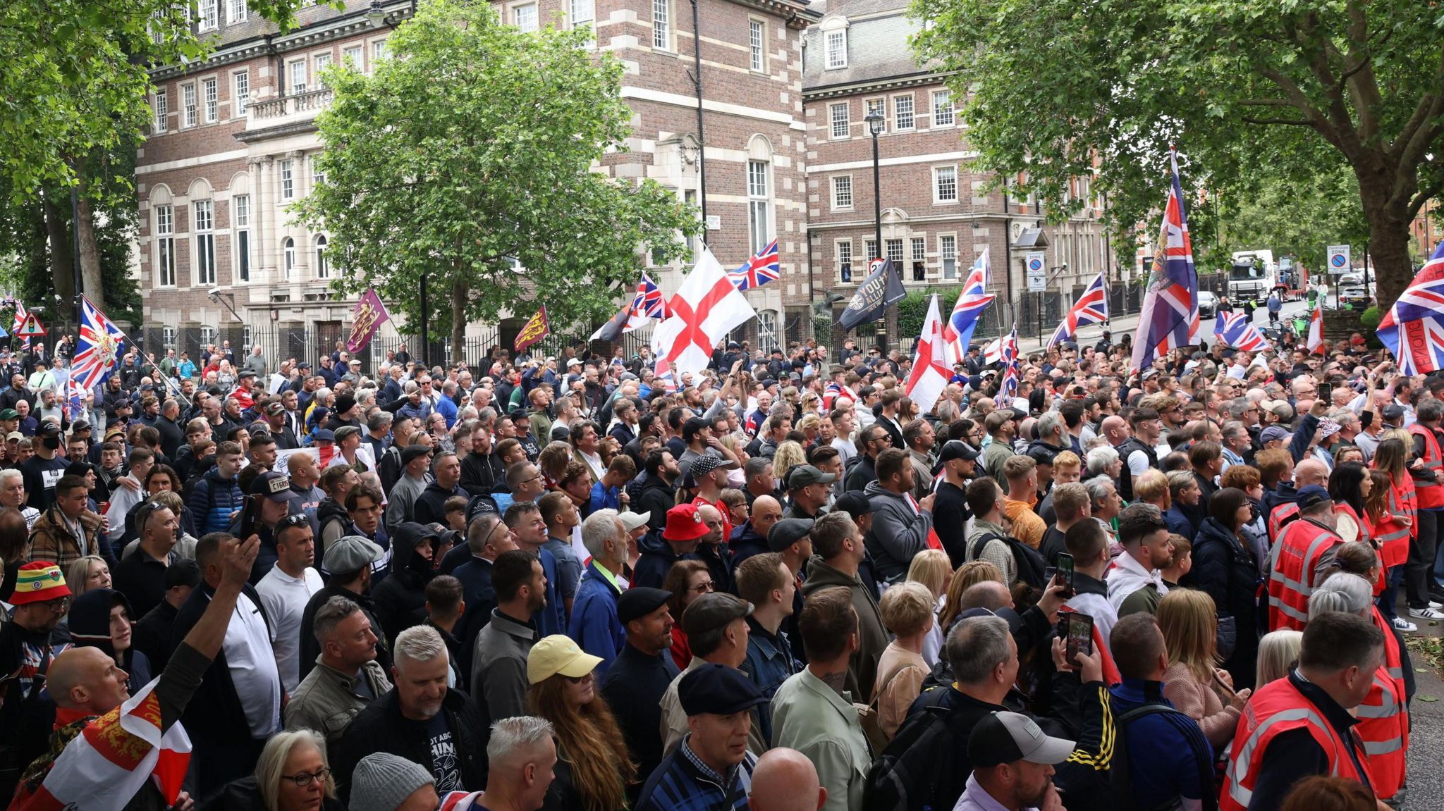People take part in a protest march through London, organised by Tommy Robinson