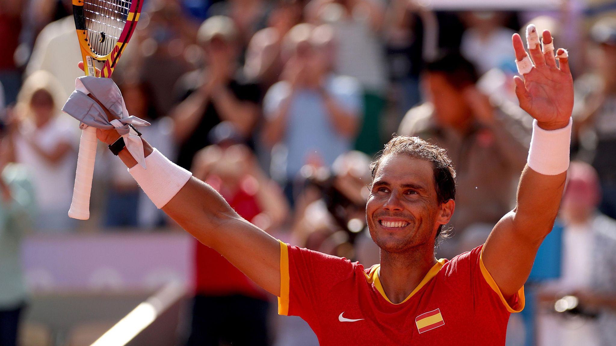 Rafael Nadal takes the acclaim of the Roland Garros crowd at the Paris 2024 Olympics