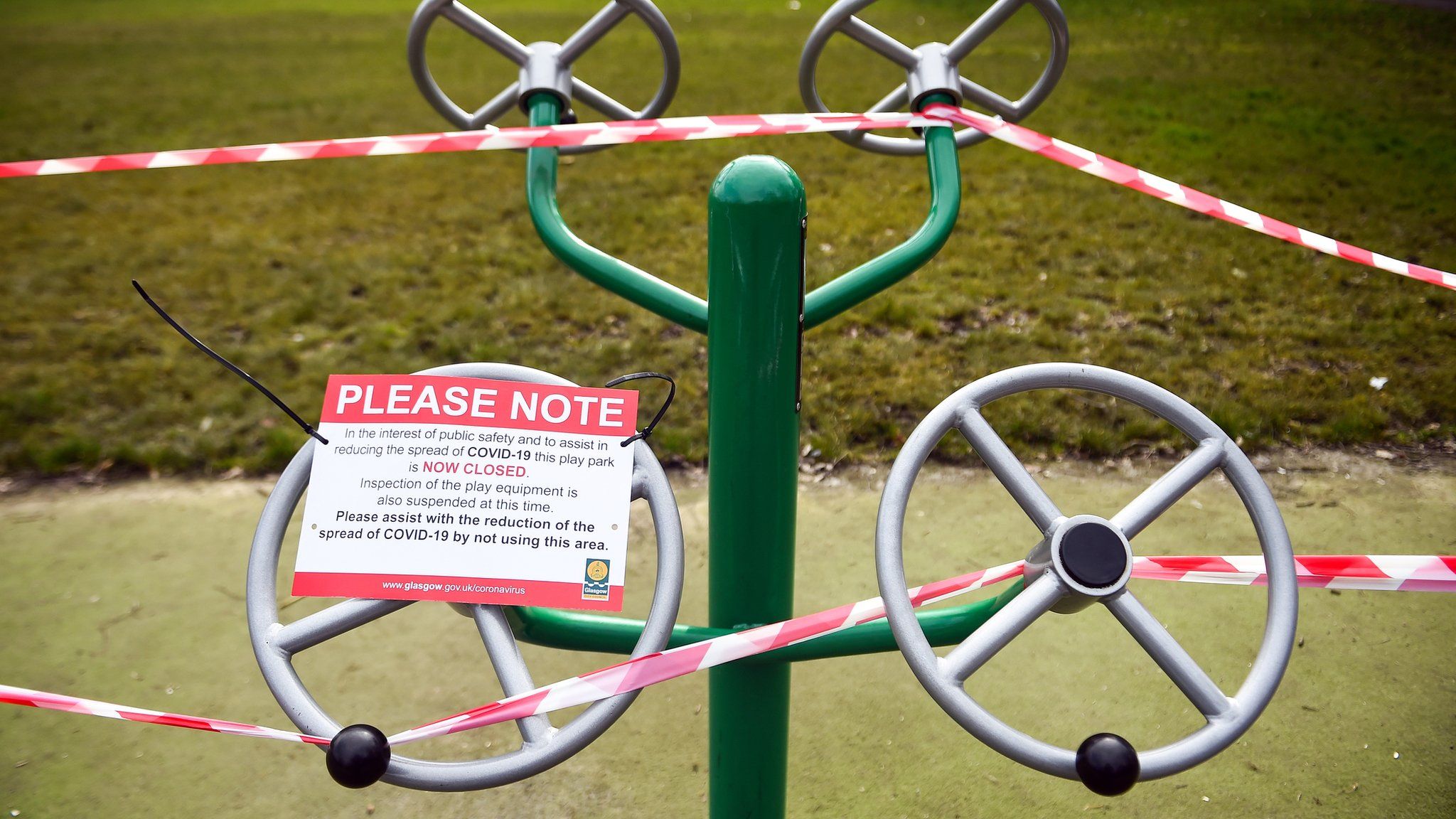 A notice warns people that the outdoor gym equipment is closed-off to the public due to the ongoing Covid-19 pandemic, in Queen's Park Glasgow