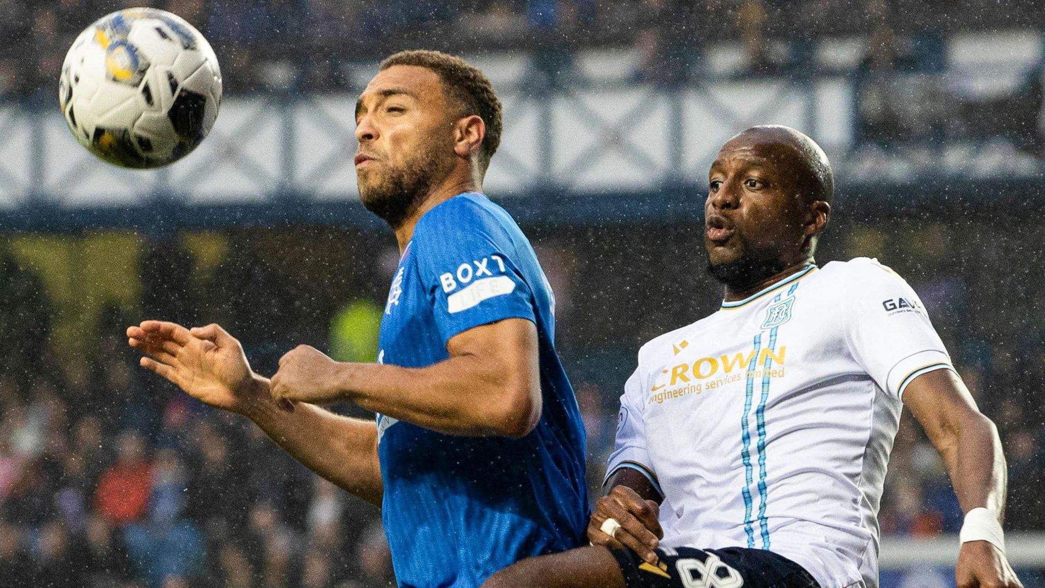 Rangers' Cyriel Dessers and Dundee's Mohamed Sylla astatine Ibrox successful May, 2024