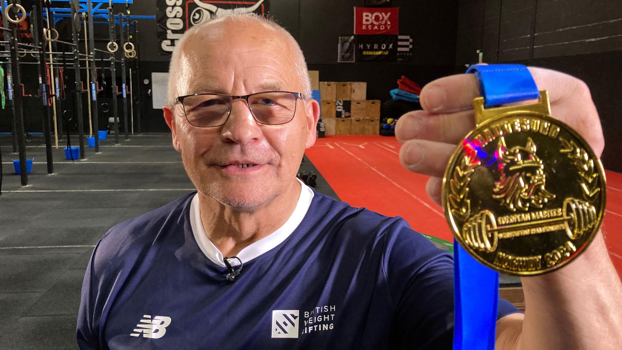 Zdzisław Bernard Trybull, known as Bernard, holding his medal