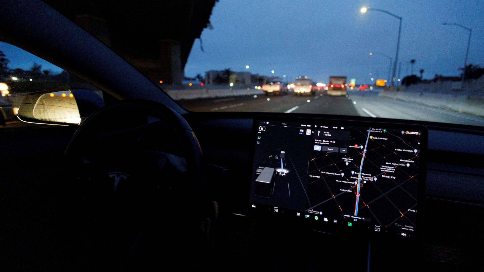  Tesla vehicle drives on autopilot along a California highway in 2022