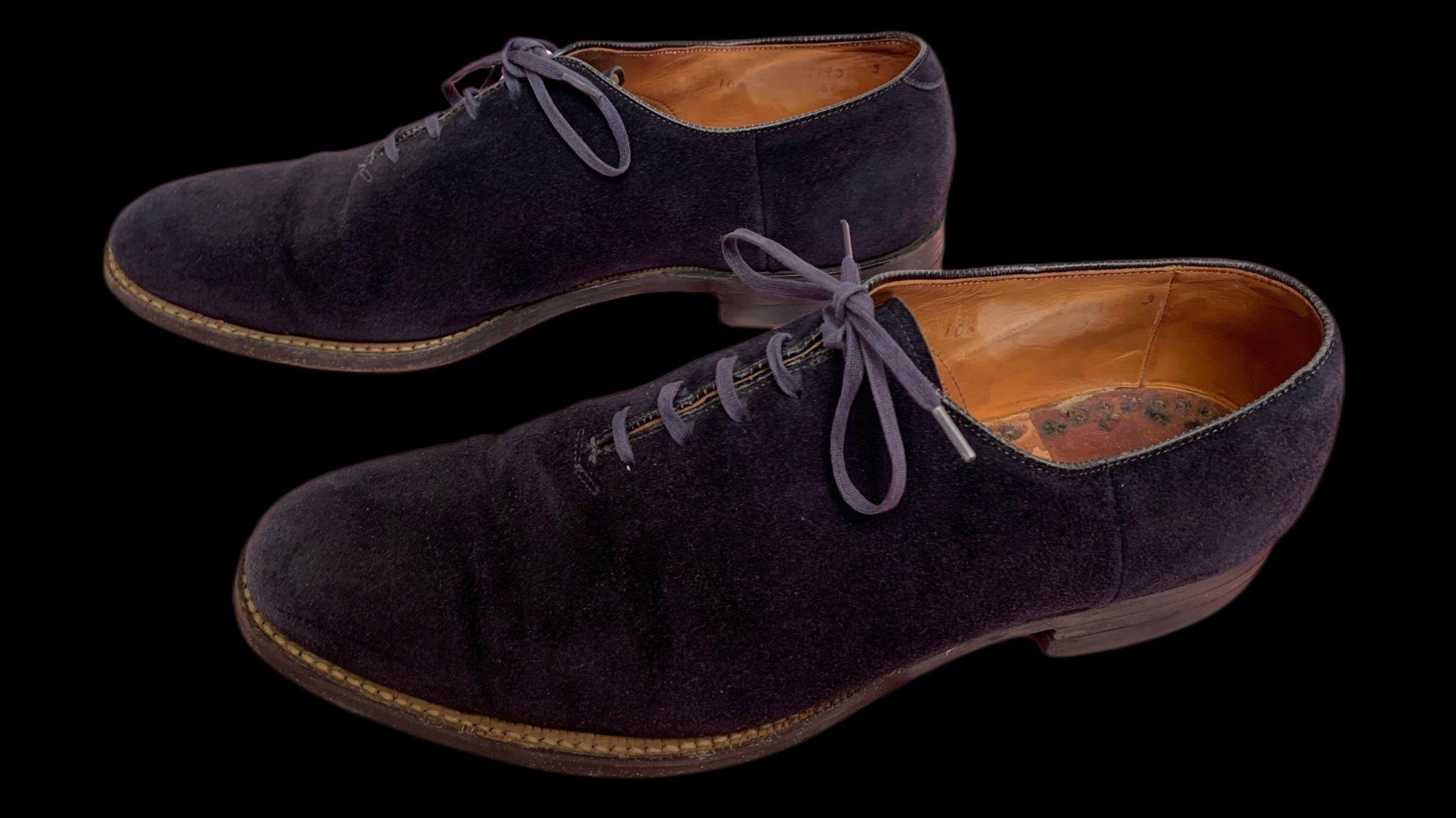 Blue suede shoes owned by Elvis which feature laces and a brown leather insole