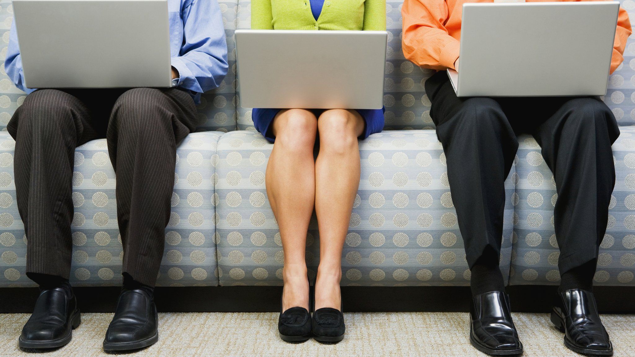 Men and a woman with laptops