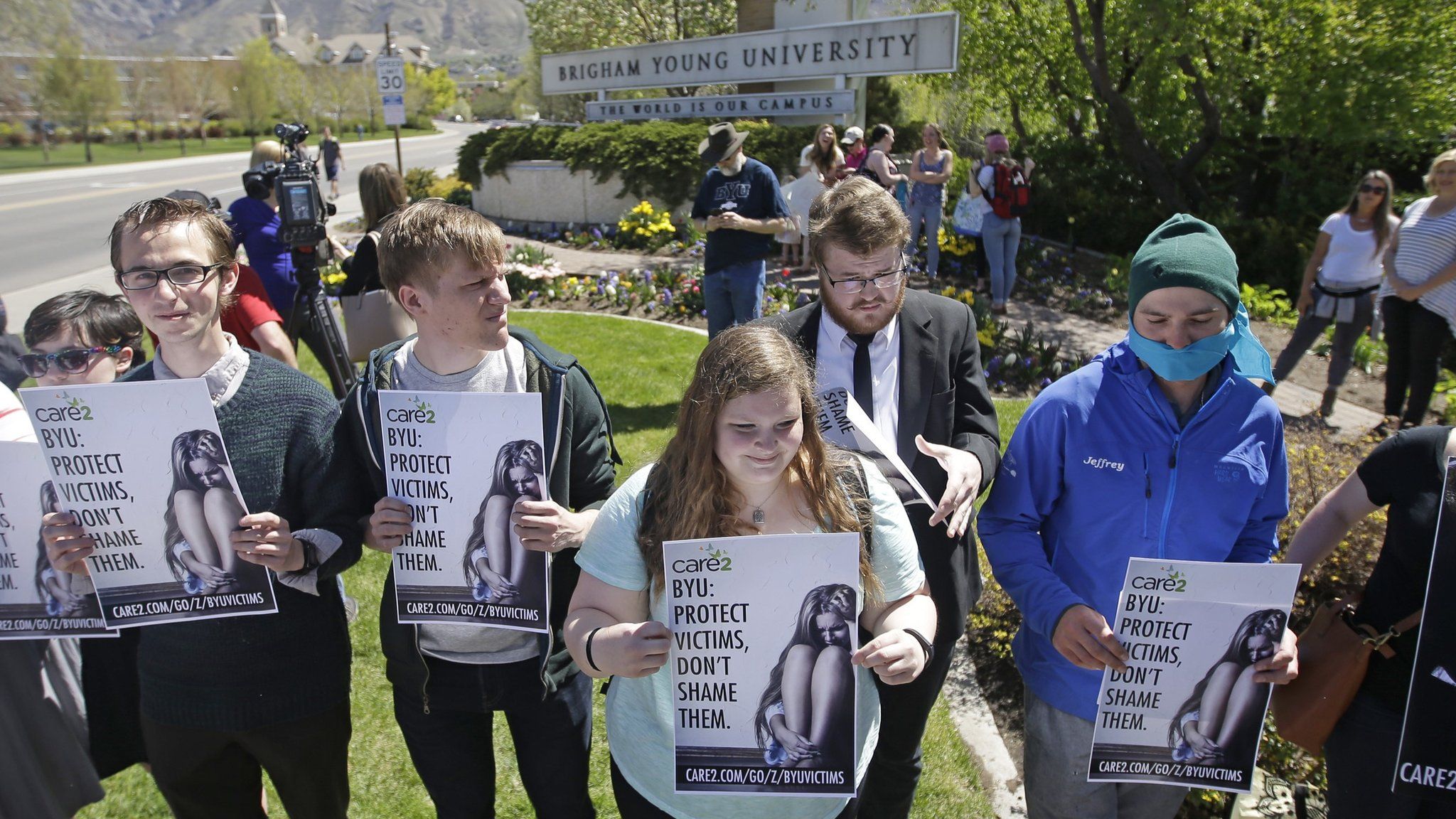 Protesters stand in solidarity with rape victims on the campus of Brigham Young University during a sexual assault awareness demonstration Wednesday, 20 April 2016, in Provo, Utah