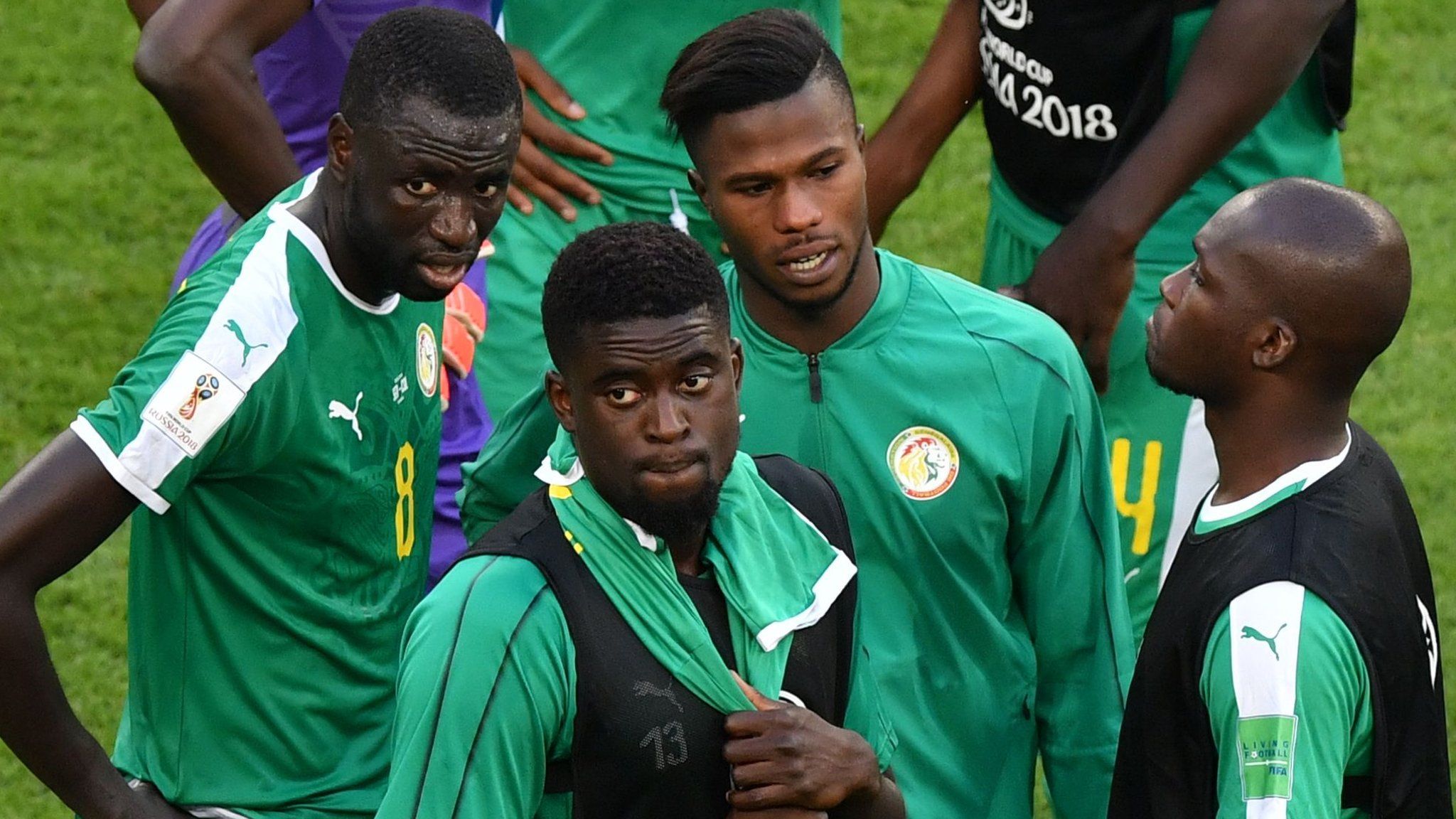 Senegal players react after being knocked out of the World Cup
