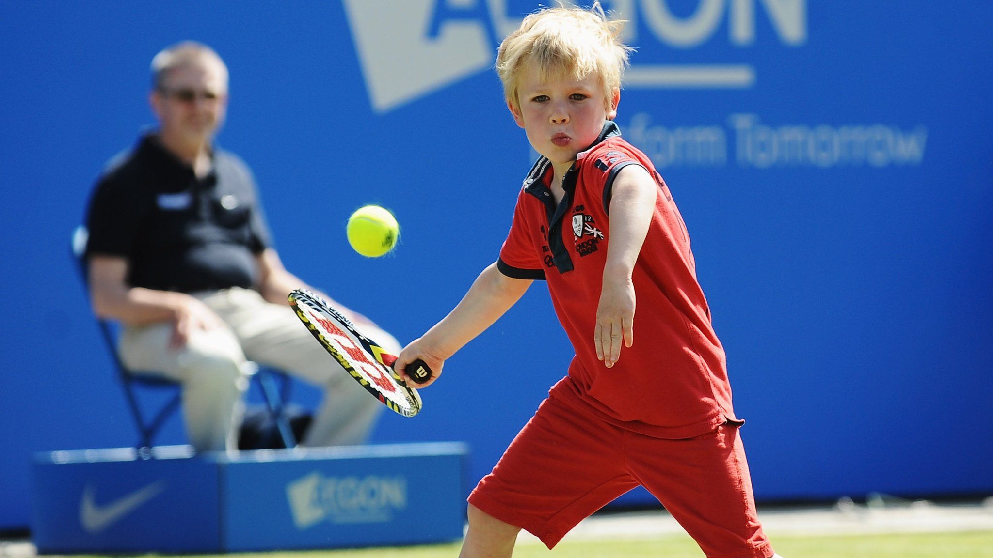 kid playing tennis