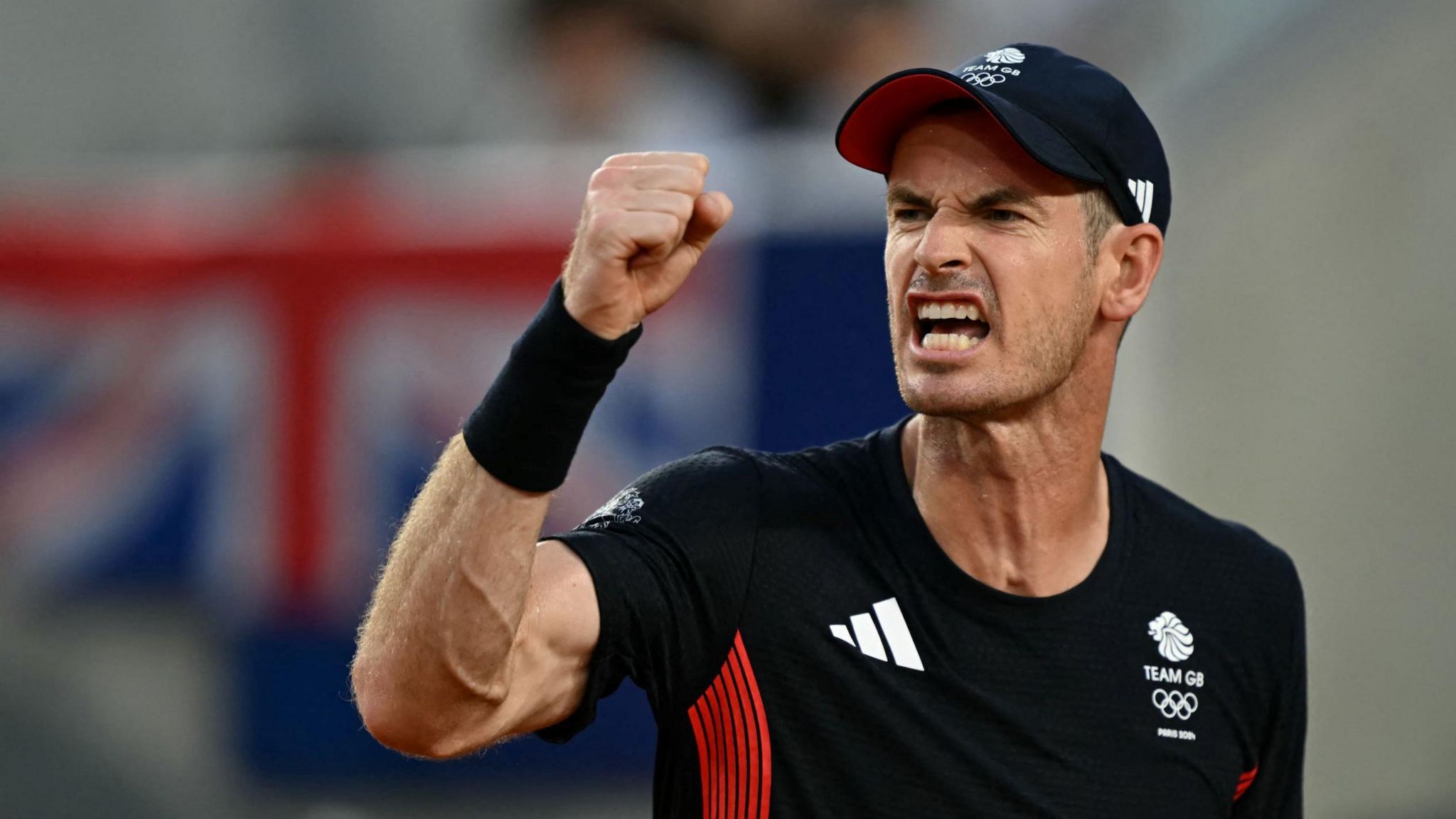 Andy Murray celebrates in his Paris 2024 Olympics match alongside Dan Evans