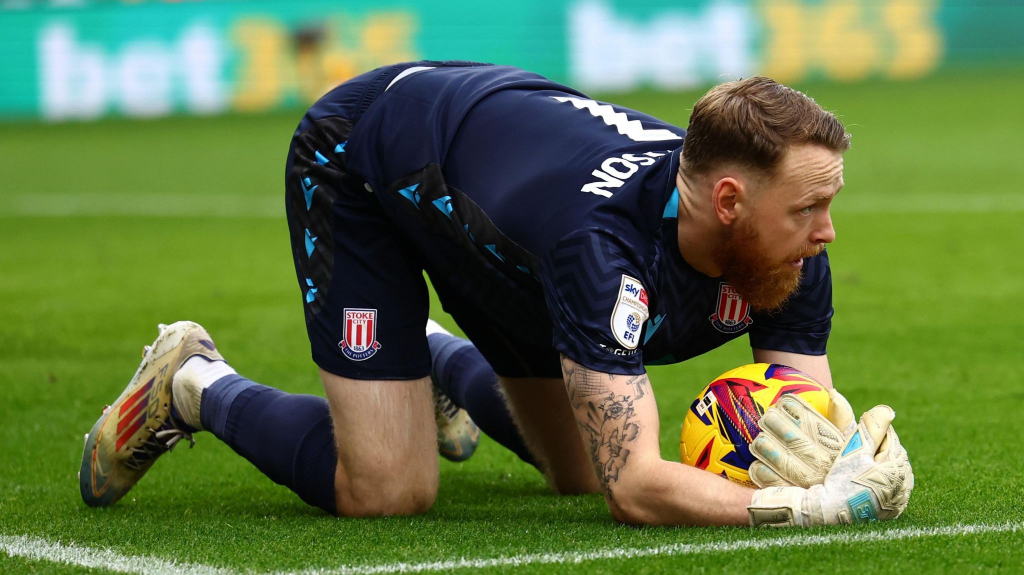 Stoke's Viktor Johansson goes down to make a save