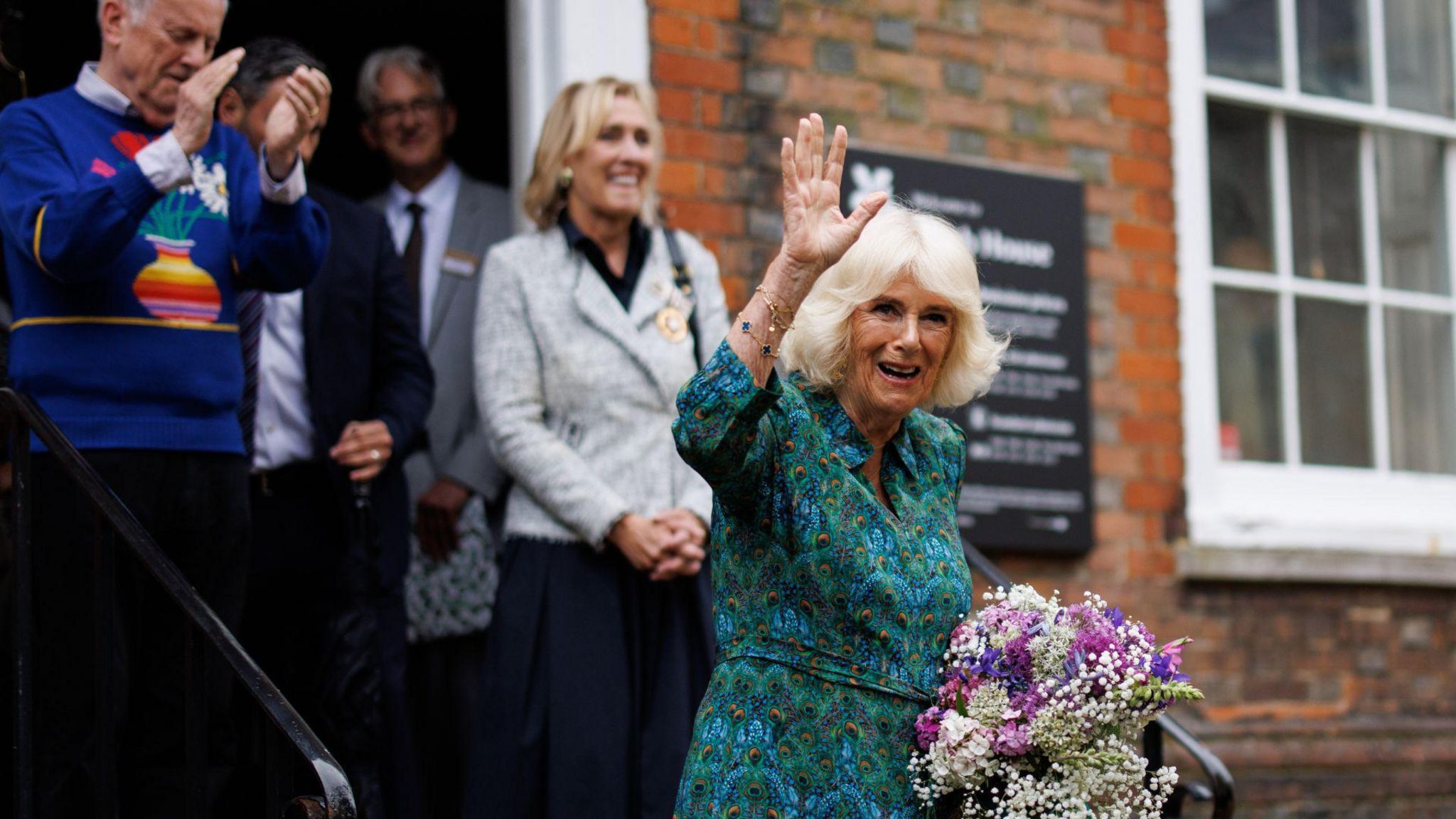 Queen Camilla waving as she leaves Lamb House
