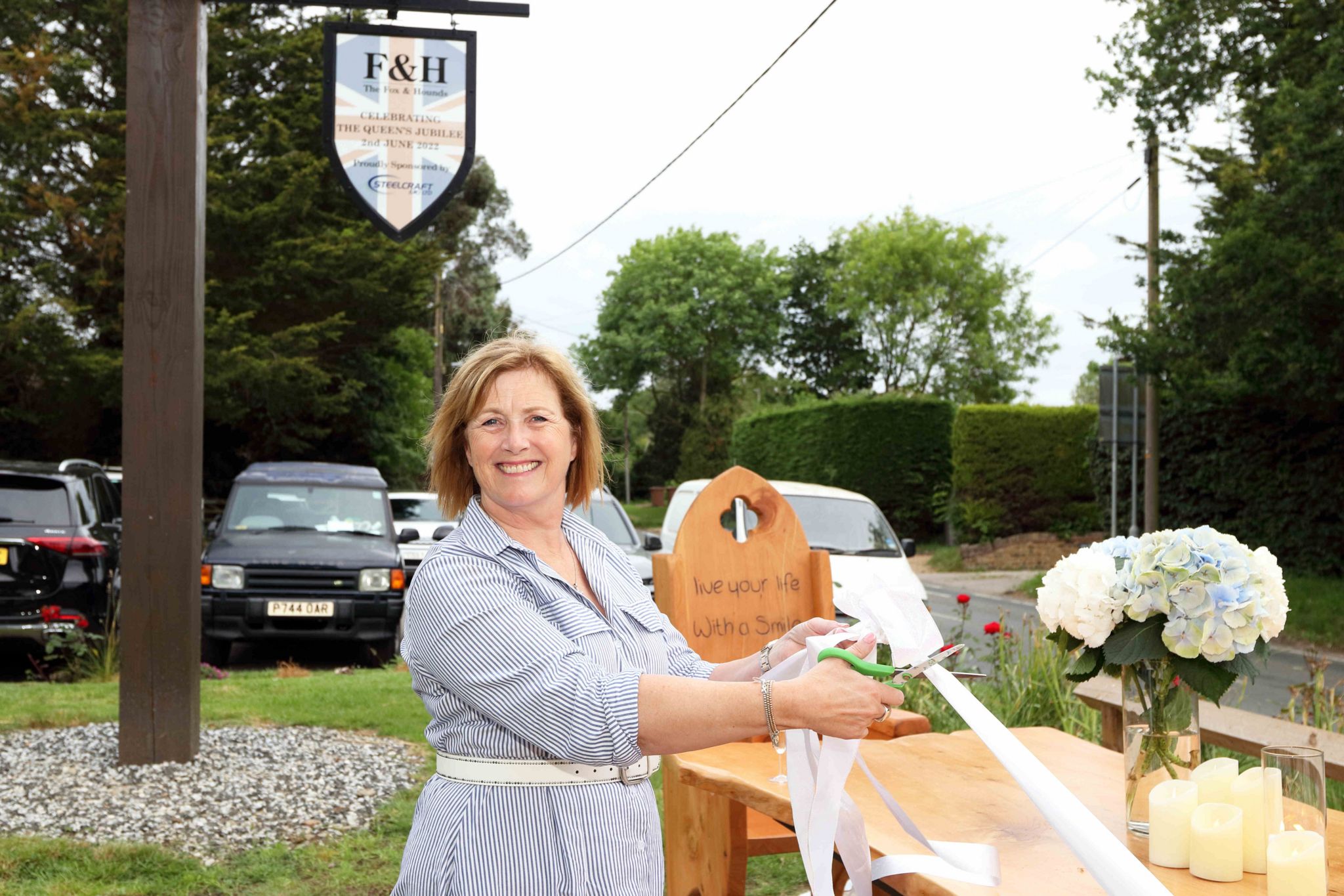 Gillian Millane cuts the ribbon on the memorial bench