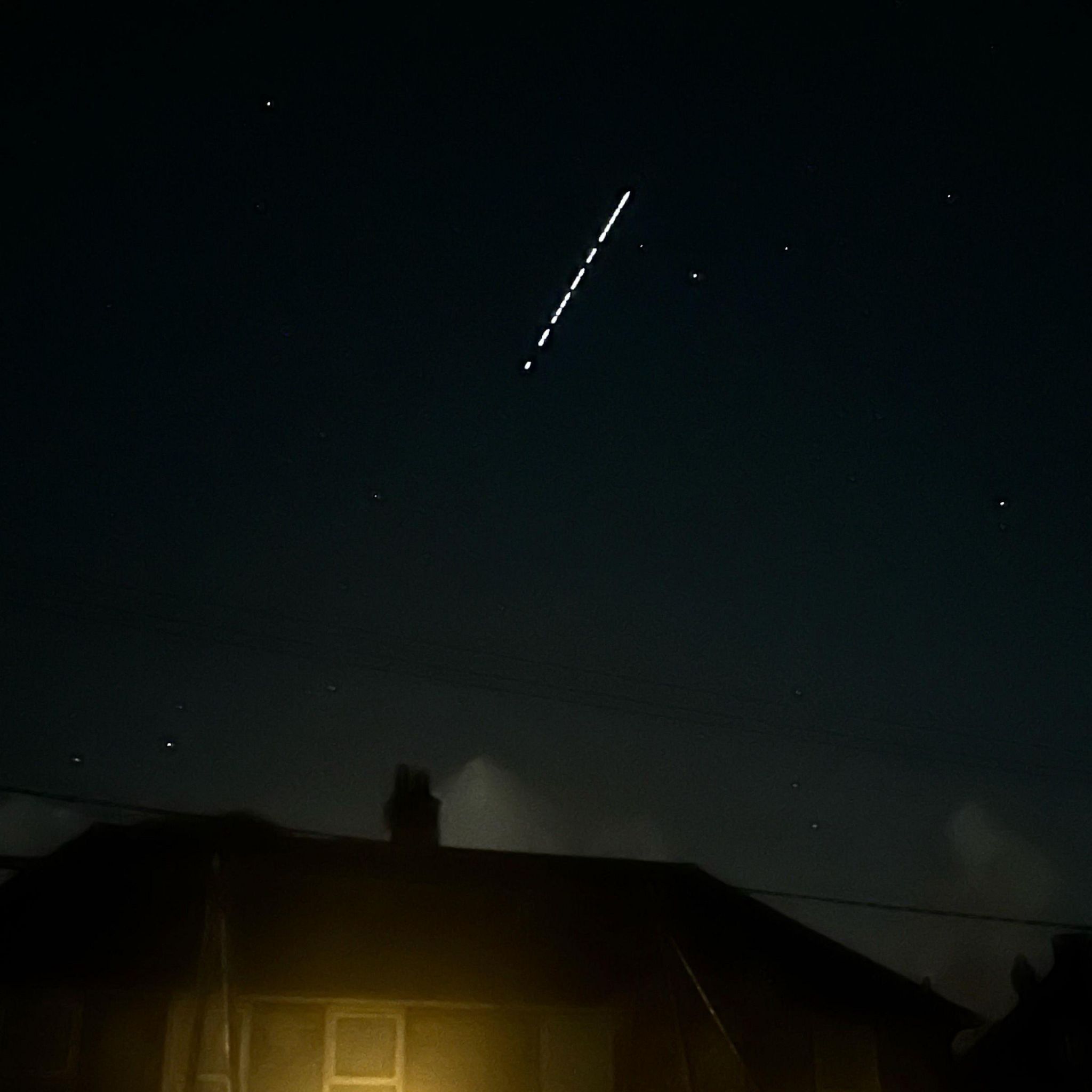 Starlink satellites seen in the sky across Godshill, Isle of Wight