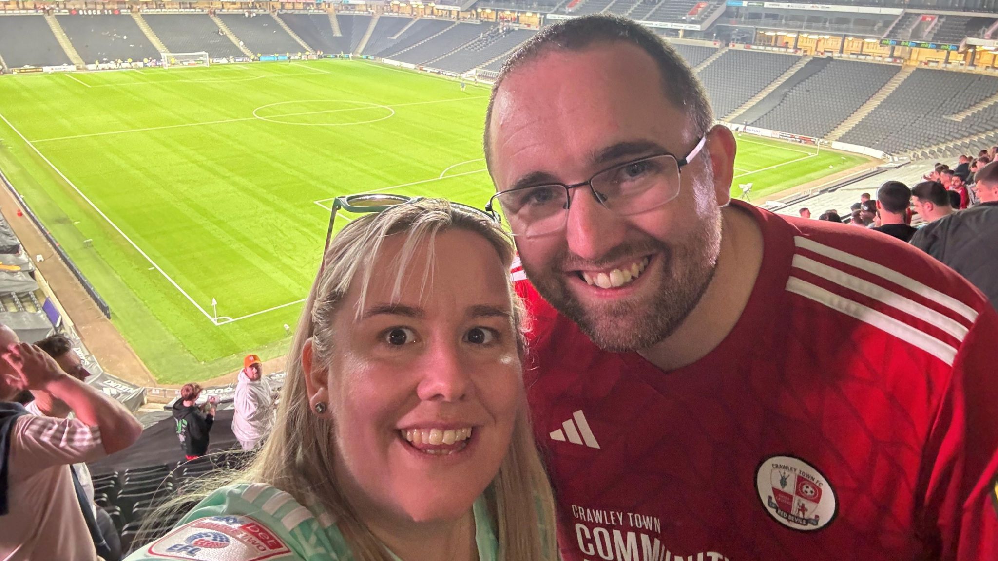 Sam Jordan and his wife take a selfie in Stadium MK from the upper tier