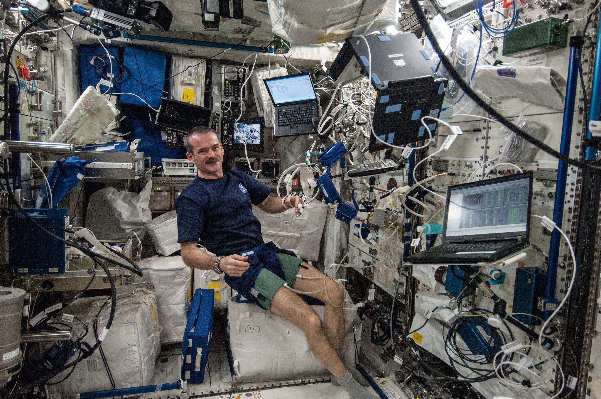 Astronaut Chris Hadfield inside a living area on the International Space Station