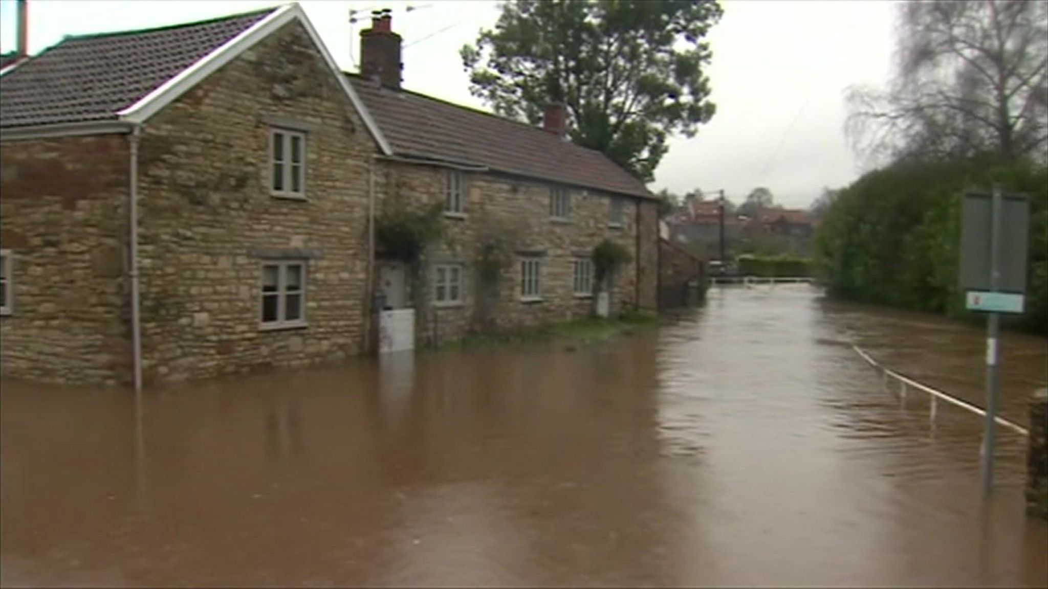 Flooded road with houses