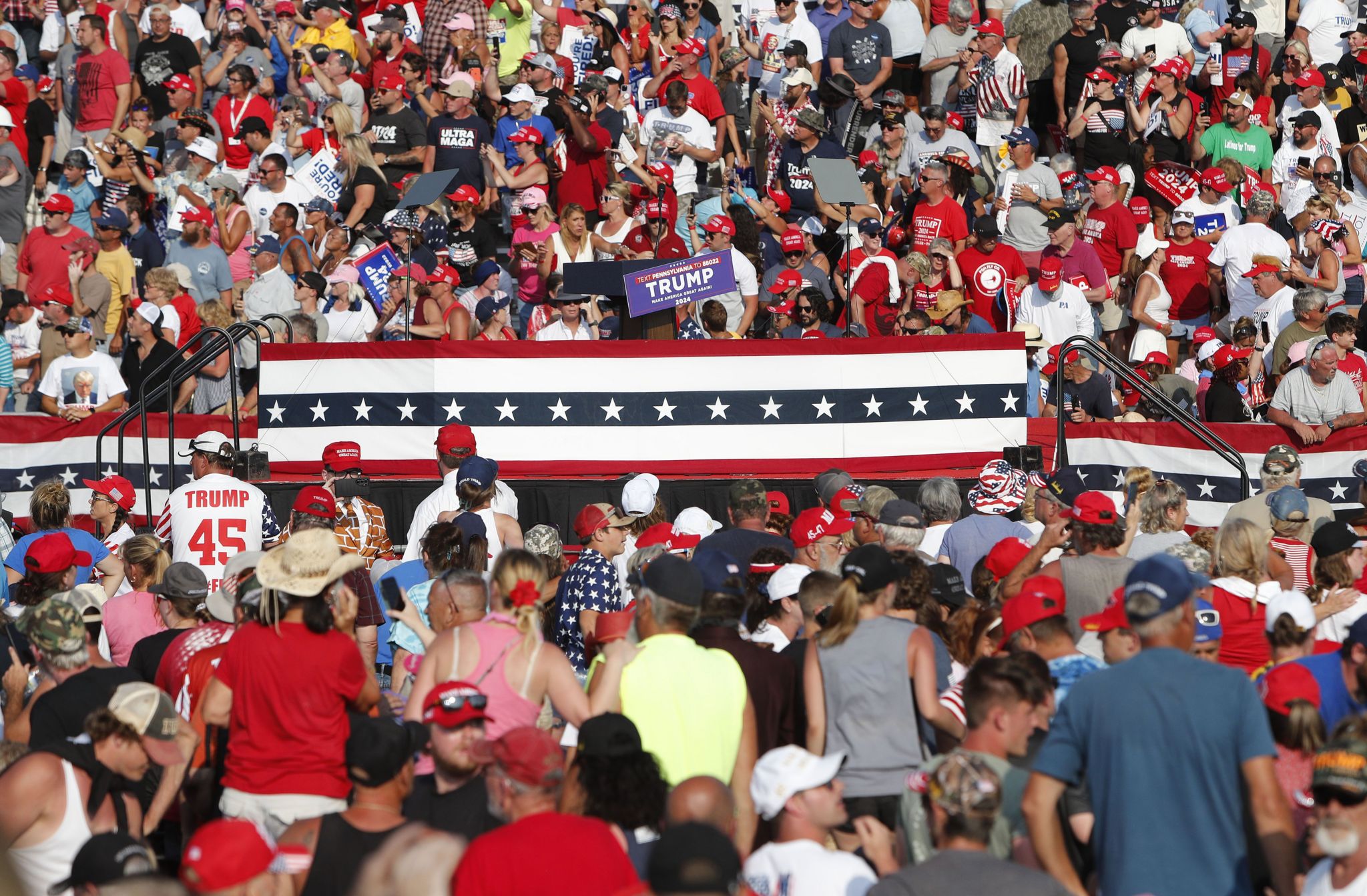 The stunned crowd after Trump is bundled off the stage