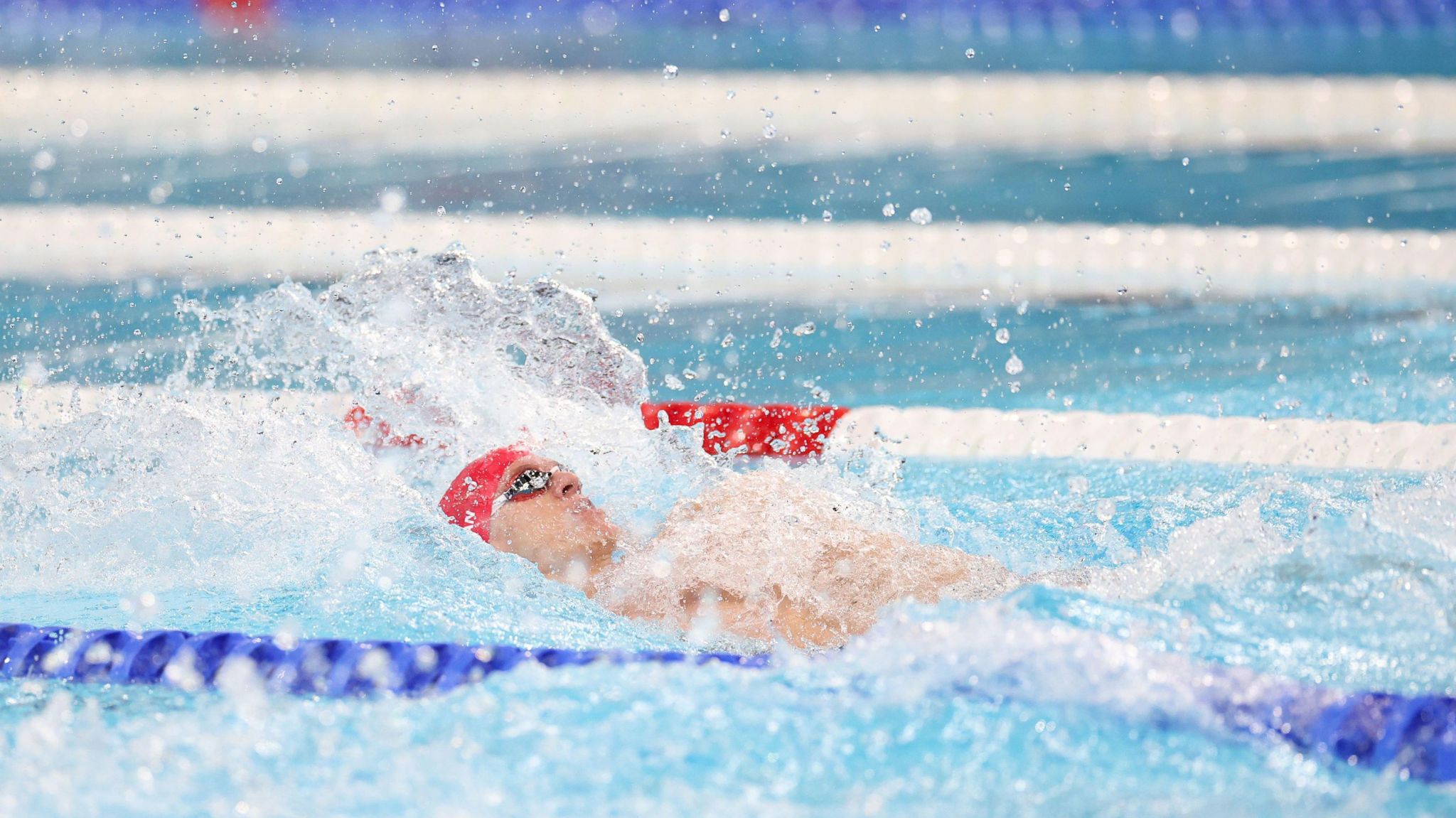 Oliver Morgan competes in the swimming men's 4x100m medley relay heat 2