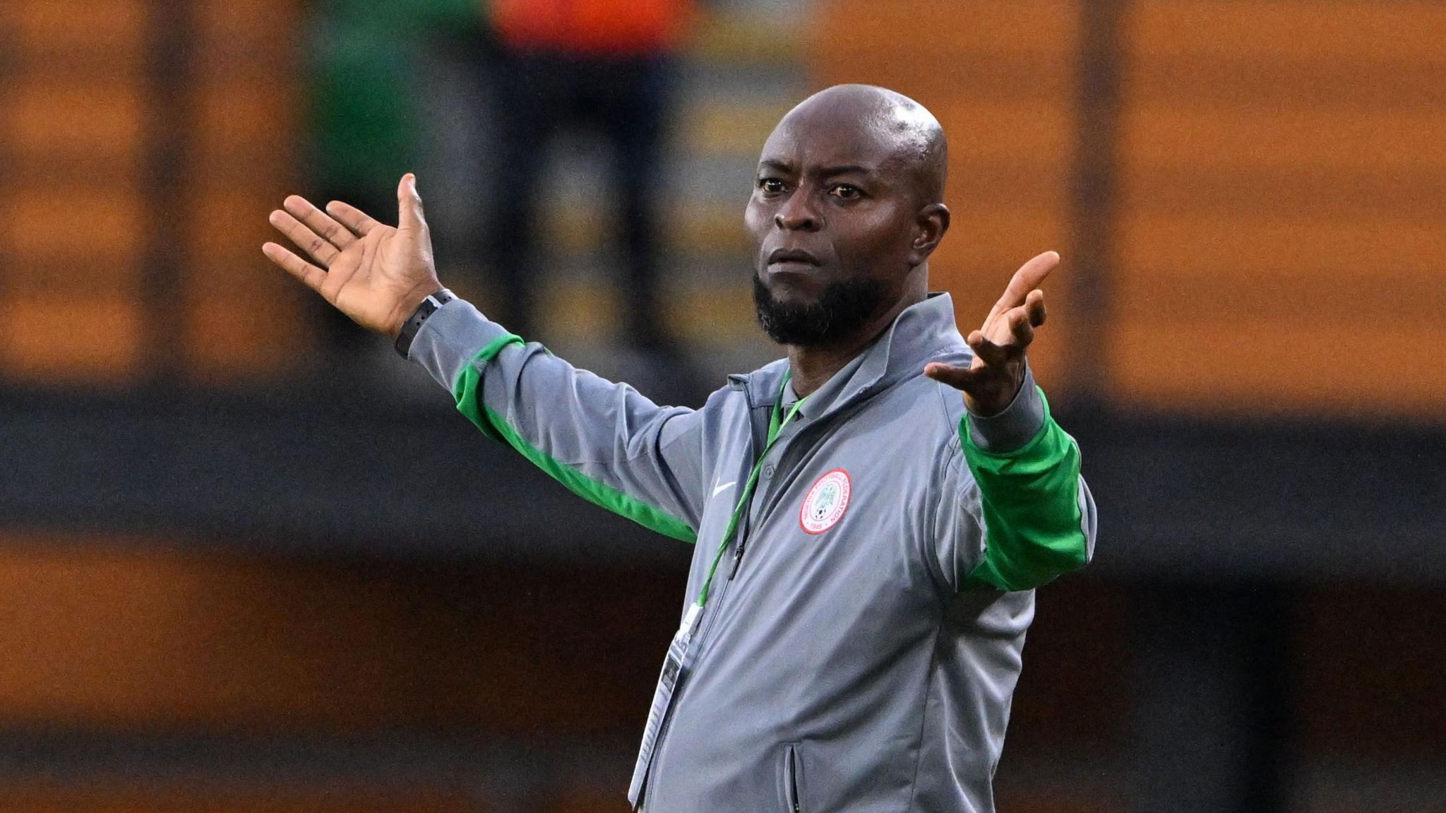 Finidi George gesticulates from the touchline during Nigeria's game against Benin