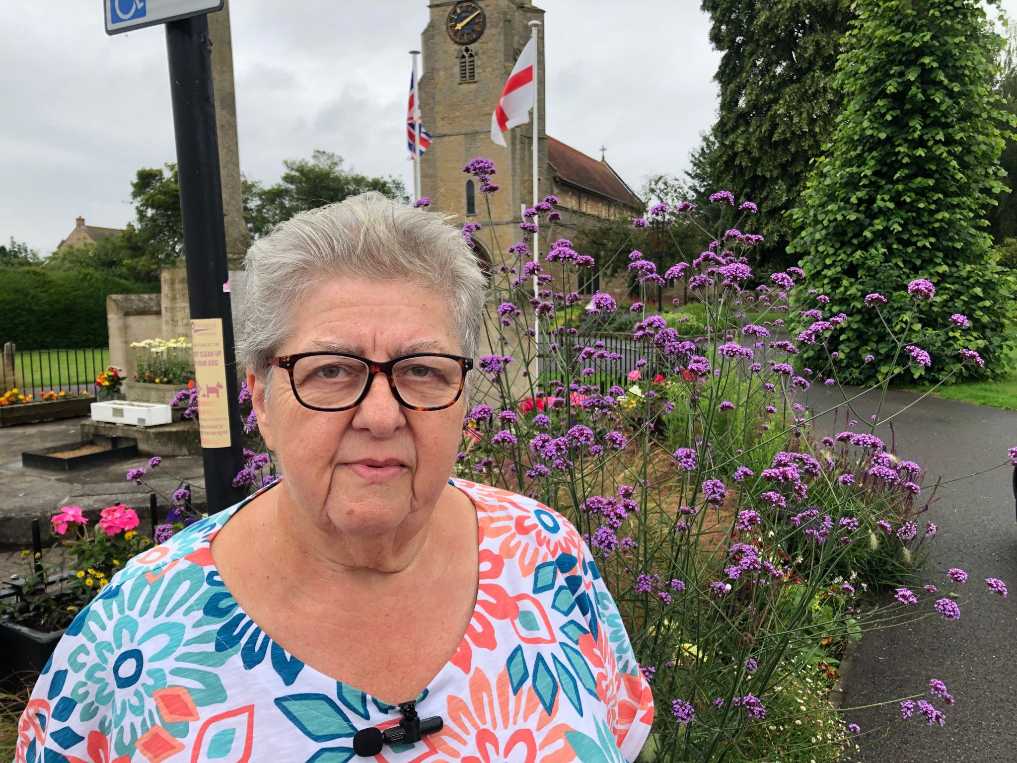 Anne Wells, chair of Chatteris in Bloom outside the parish church in town