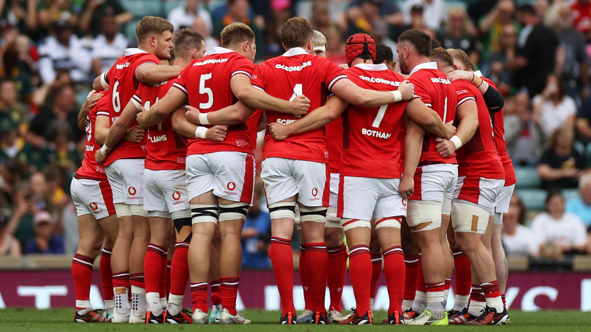 Wales players successful a huddle against South Africa