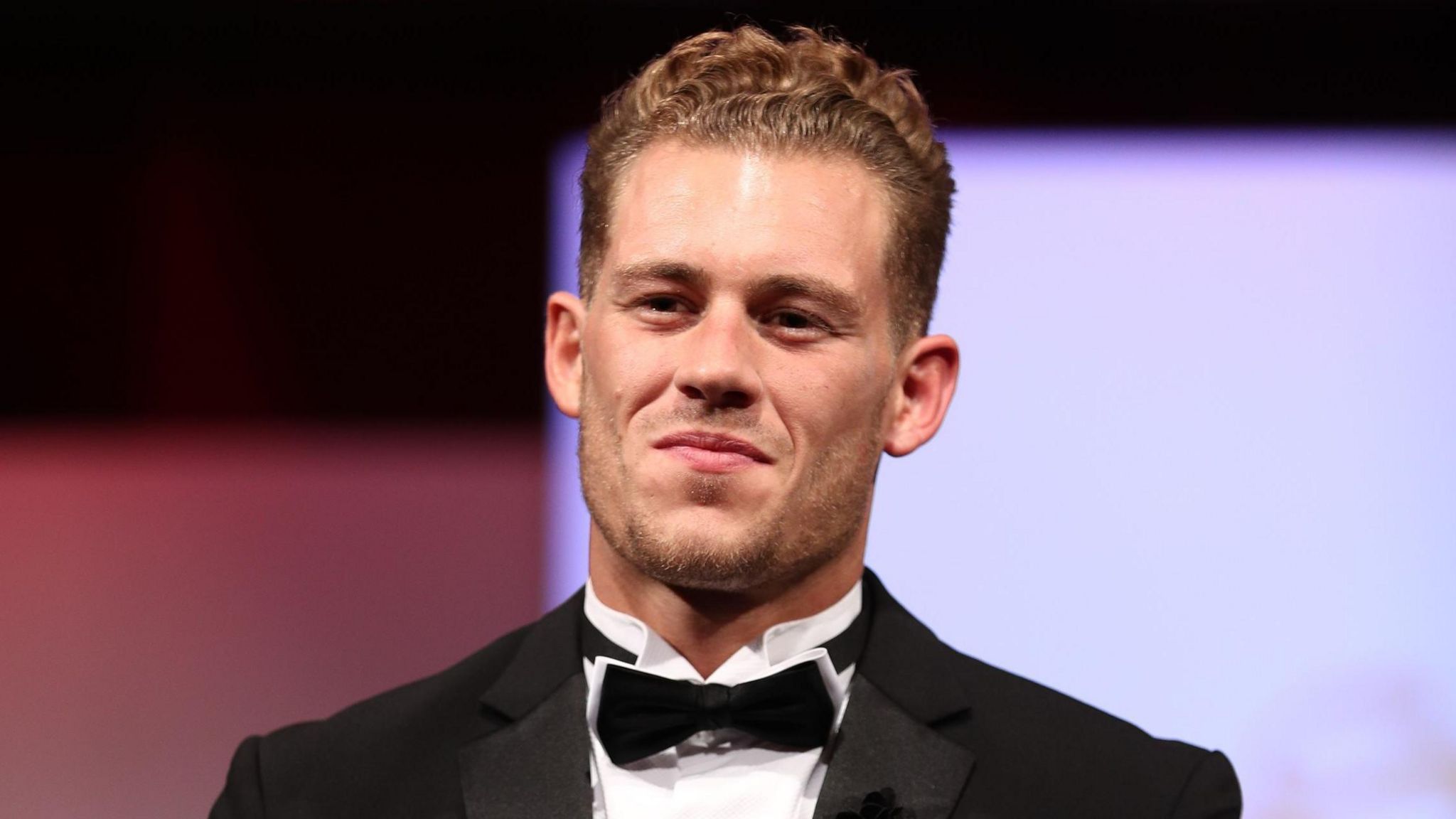 Jack Eyers in a black jacket, white wing collar and black bow tie at the 2017 Mr England contest