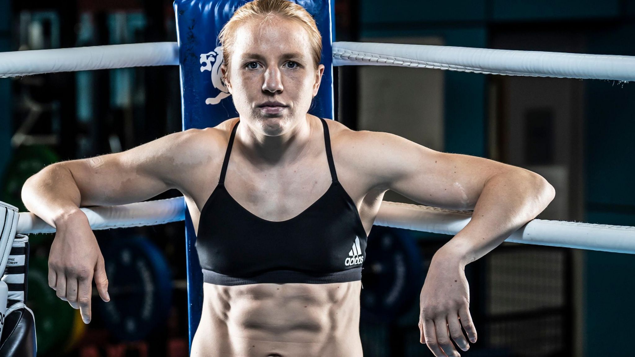 Team GB's Rosie Eccles posing with her hands on the ring apron